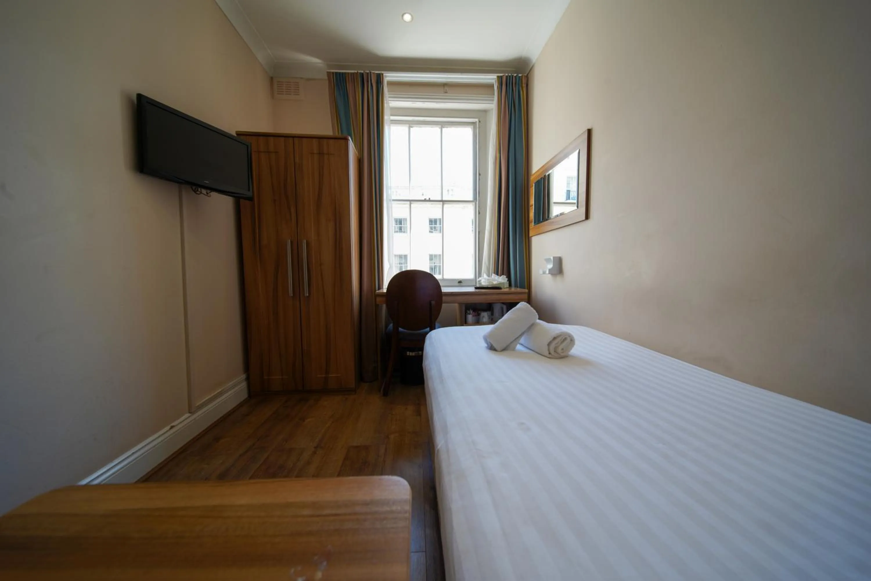 Bed in Royal Eagle Hotel