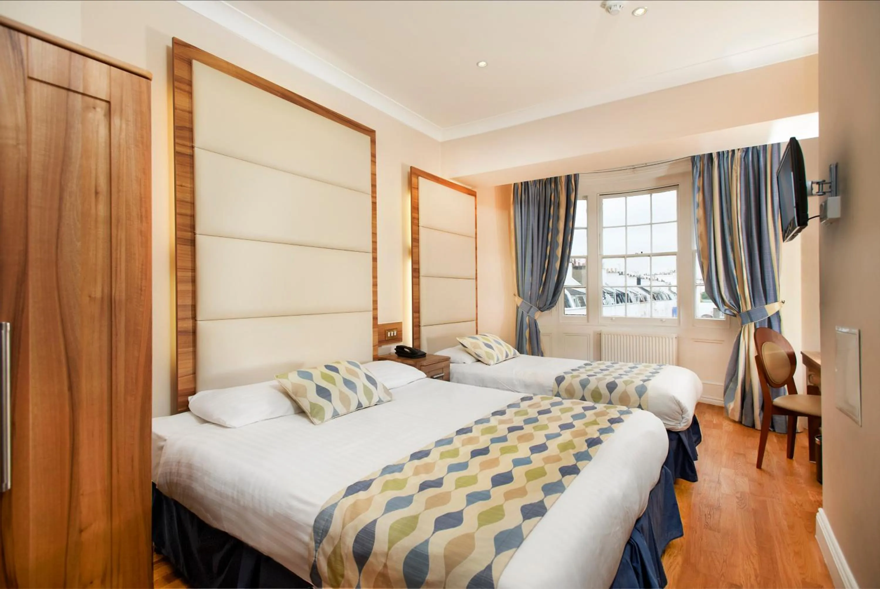 Bed in Royal Eagle Hotel