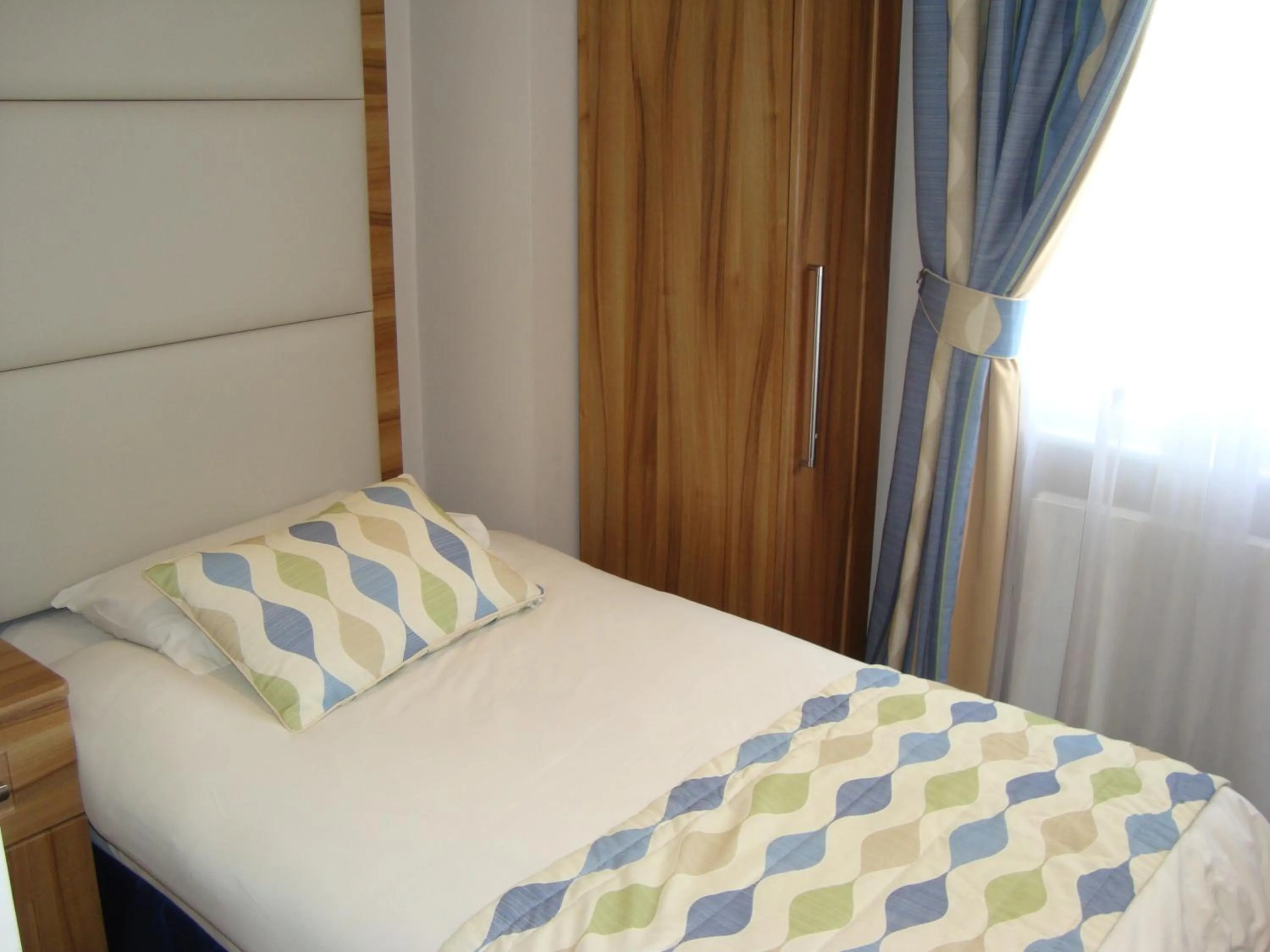 Bed in Royal Eagle Hotel