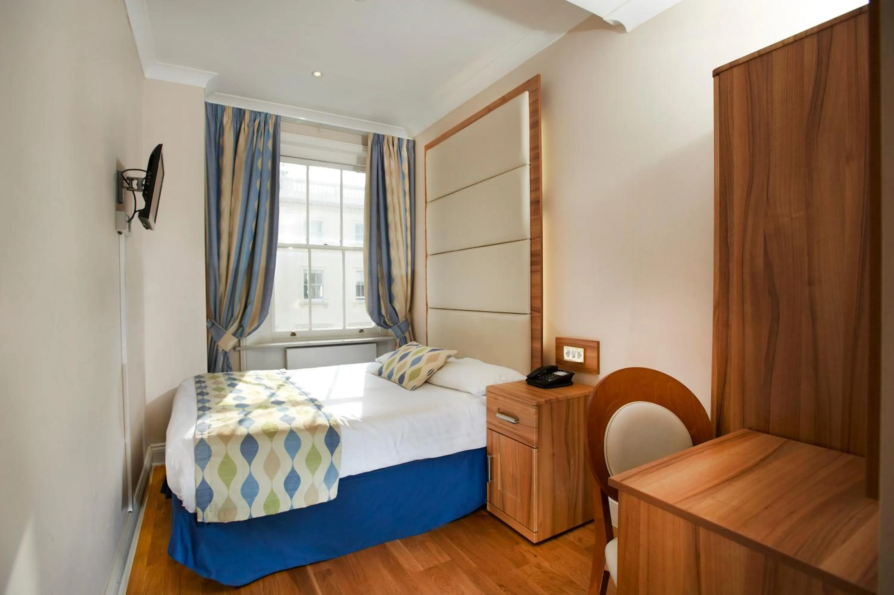 Bed in Royal Eagle Hotel