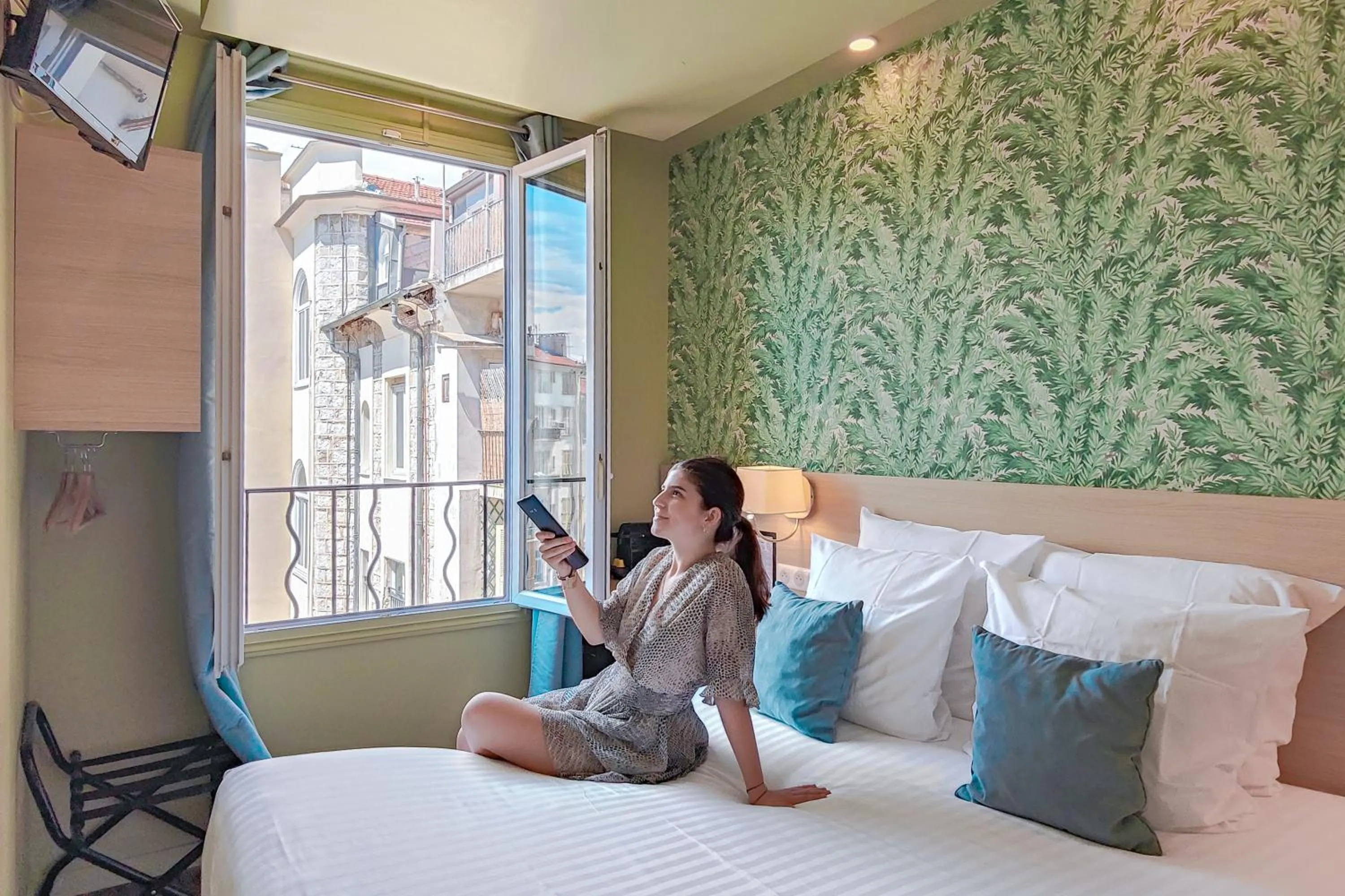 Bed in Hôtel Du Centre, un hôtel AMMI