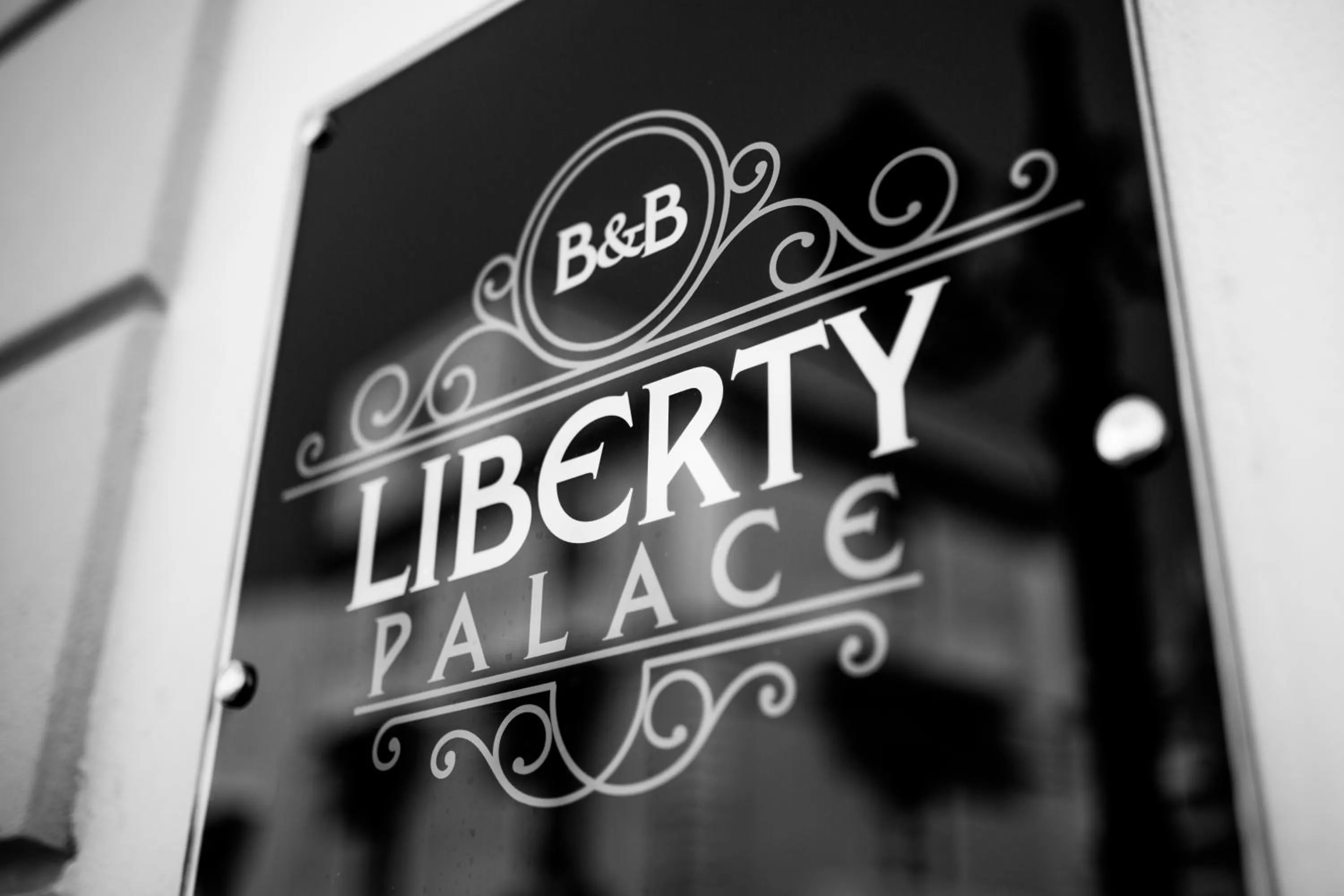 Property logo or sign in Liberty Palace