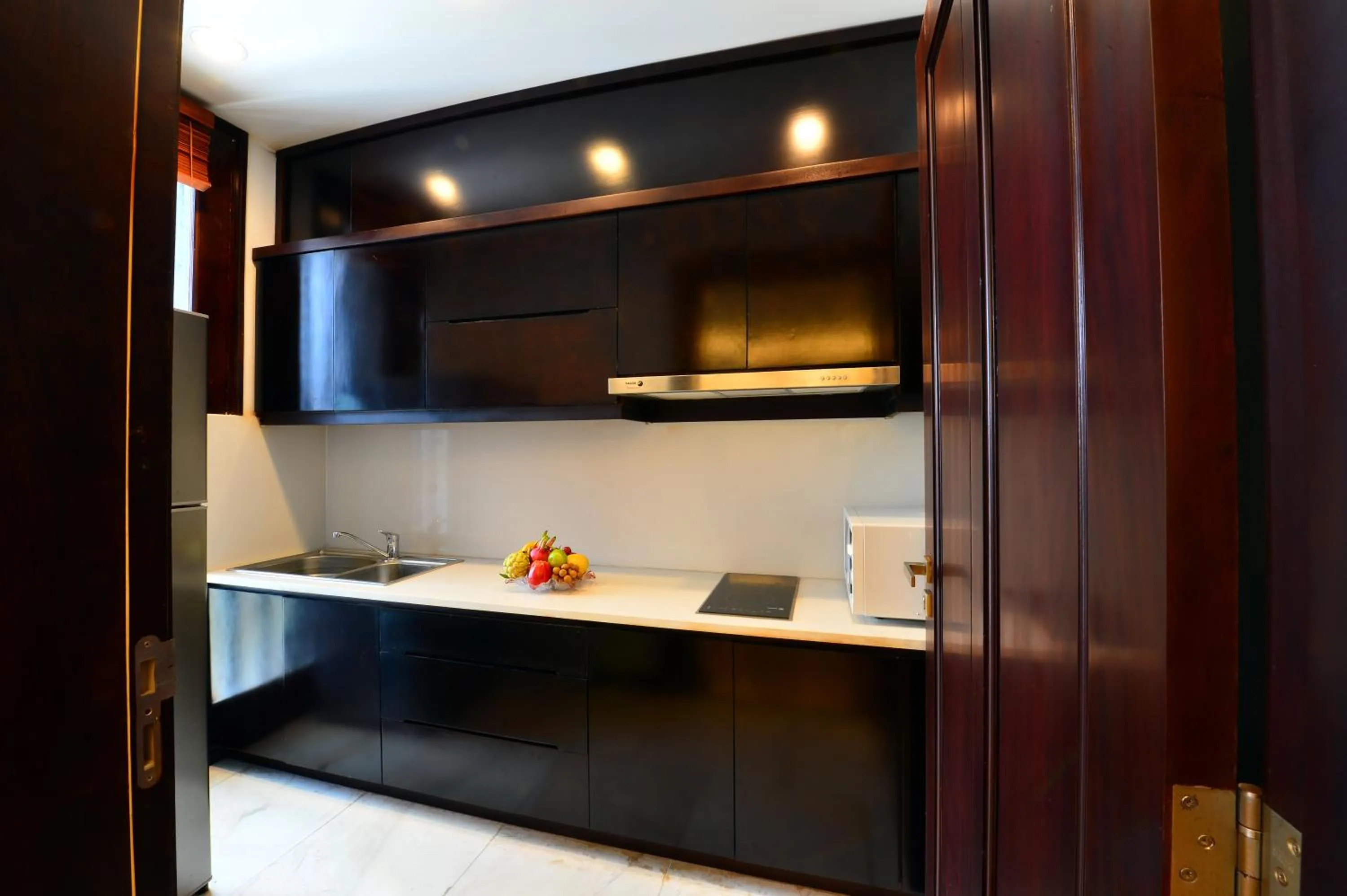 Kitchen or kitchenette in NCC Garden Villas - NCC Hotel