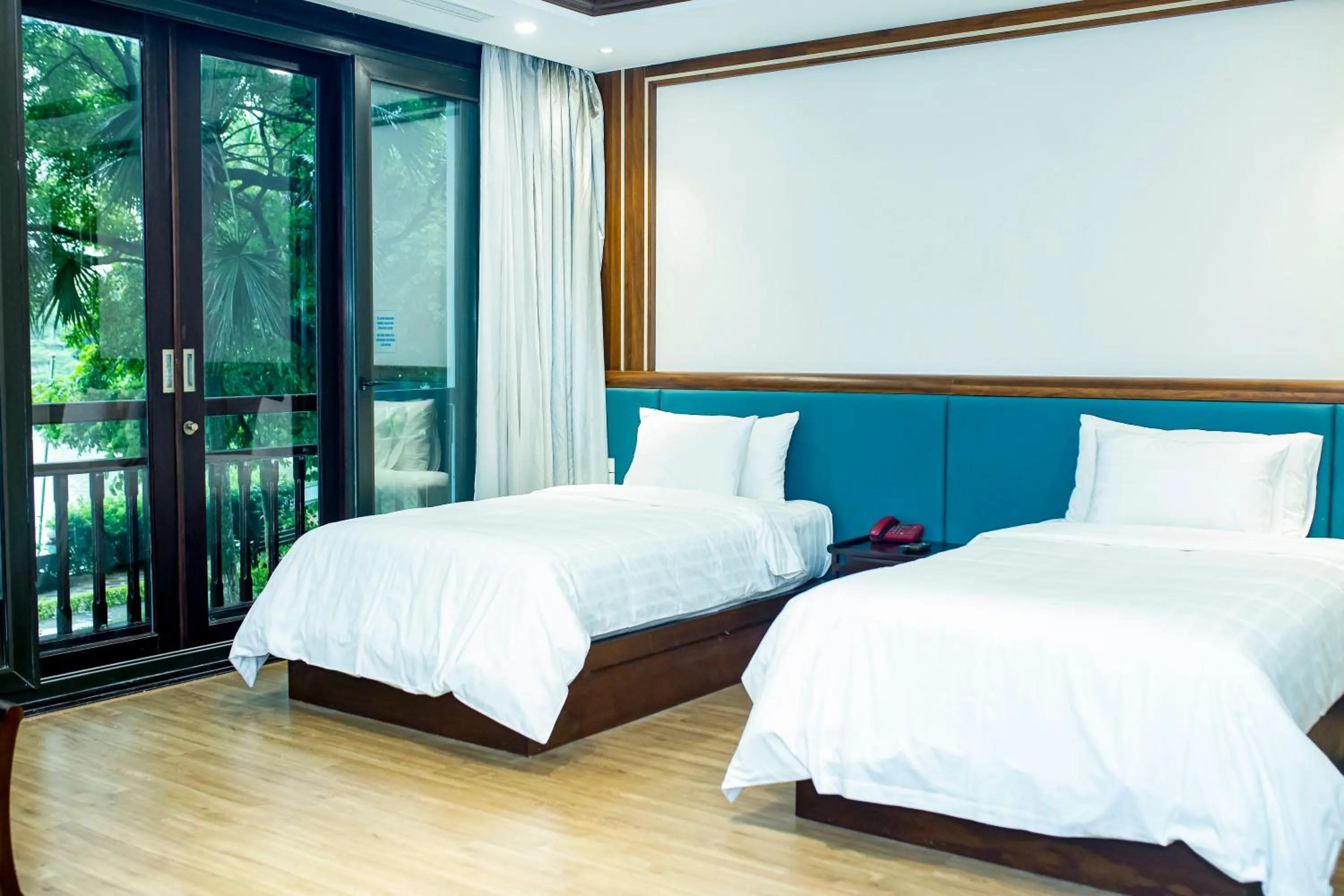 Bed in NCC Garden Villas - NCC Hotel