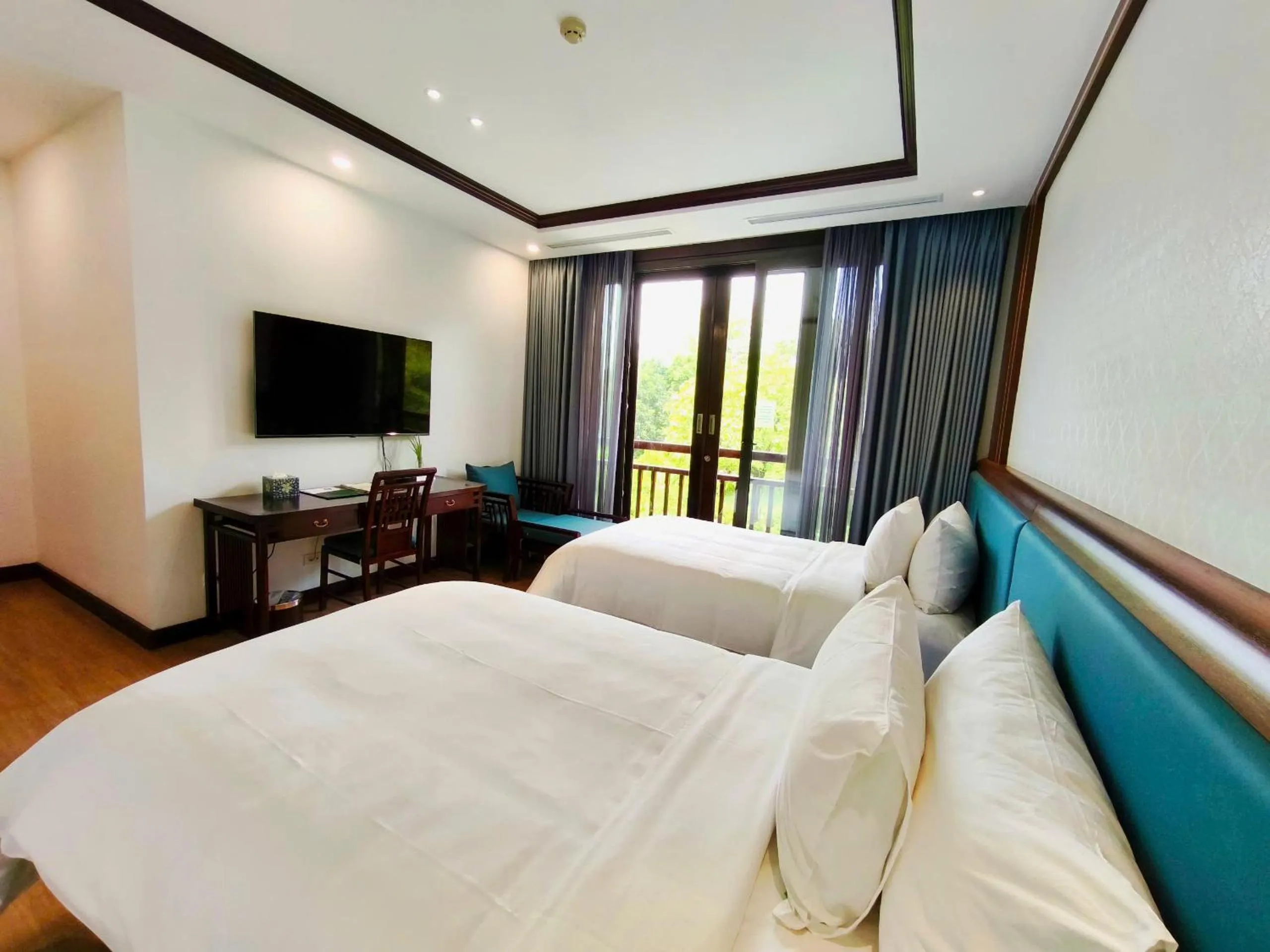 Bed in NCC Garden Villas - NCC Hotel