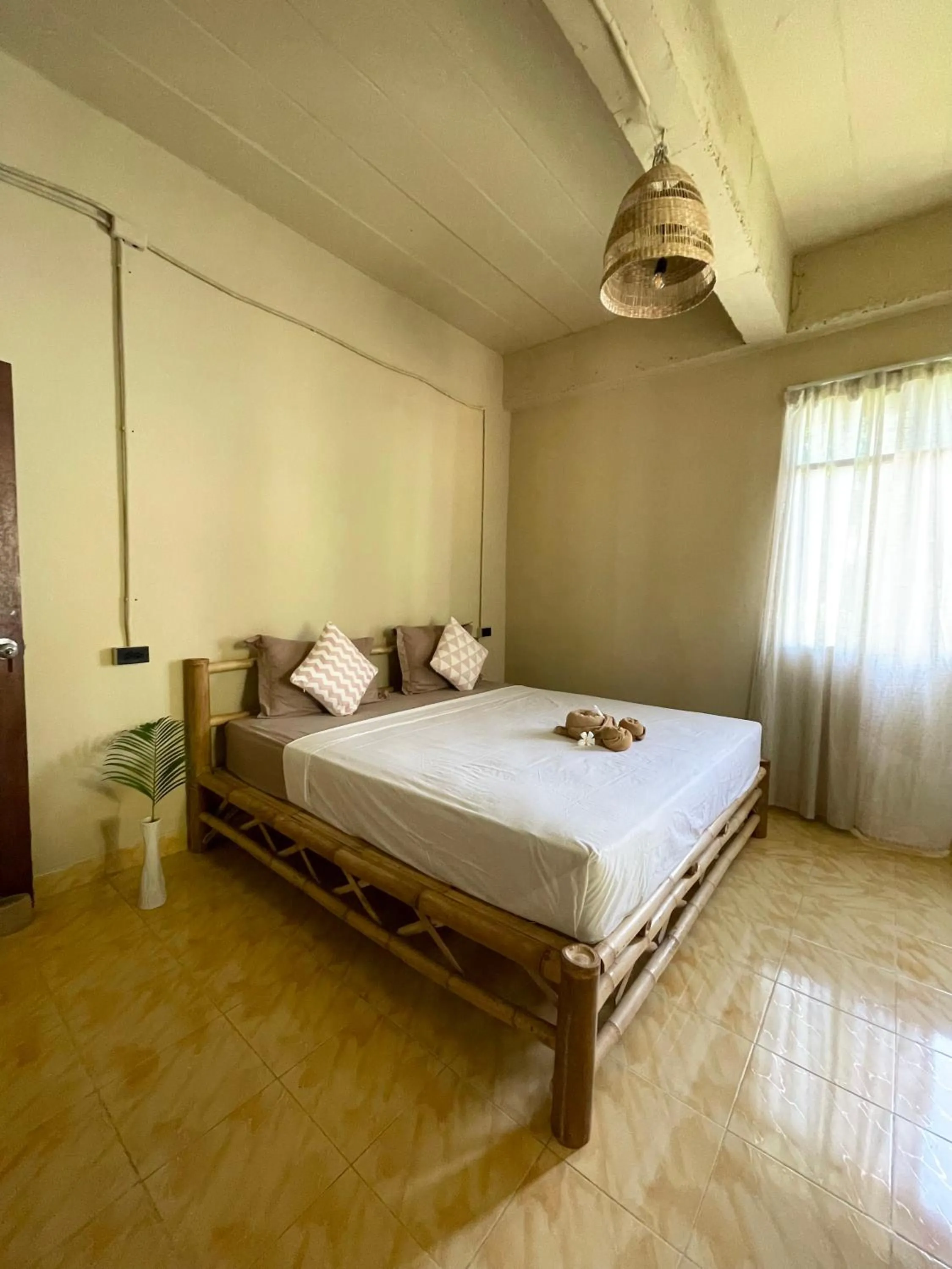 Bed in Mythai Guesthouse