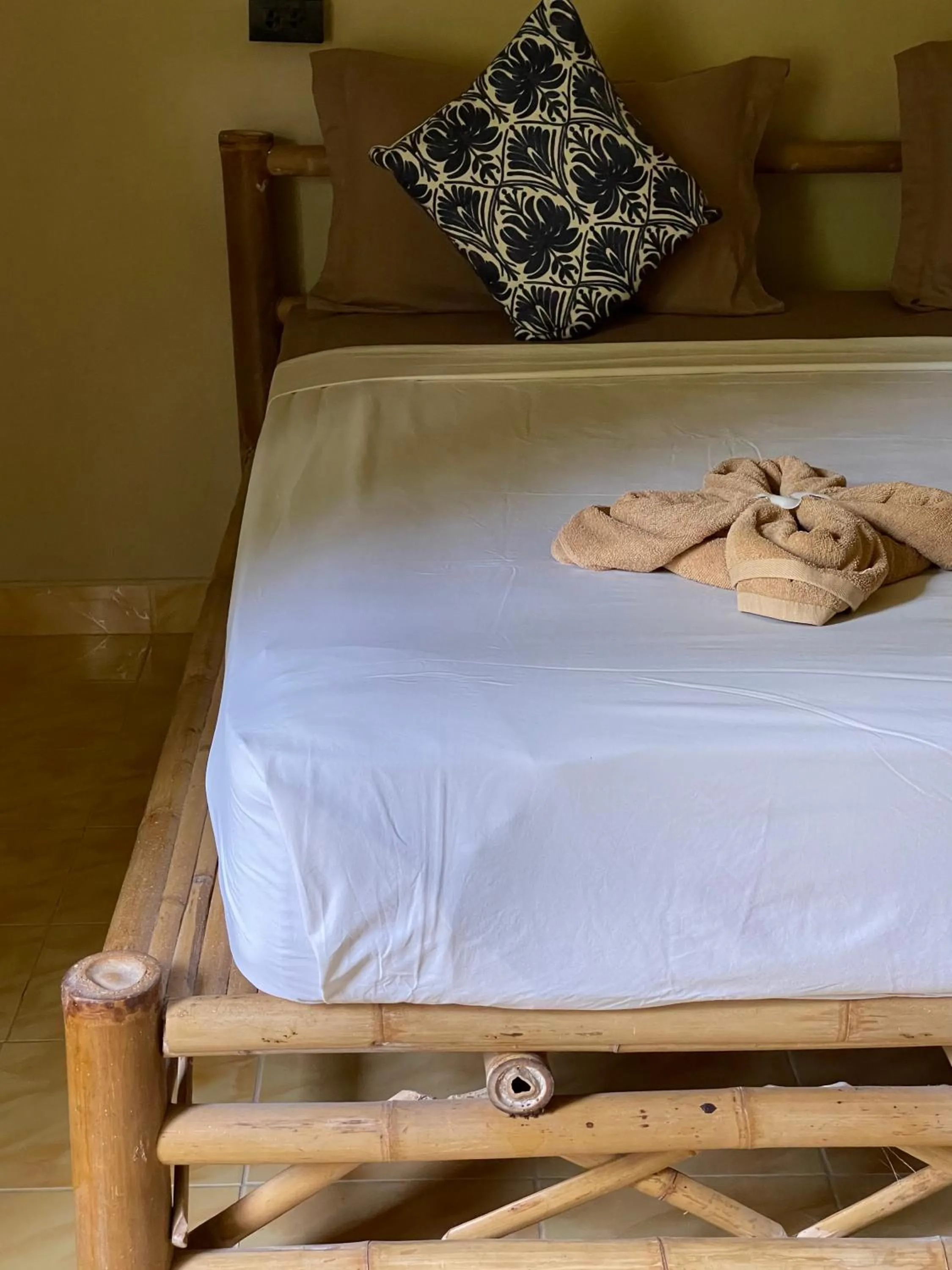 Bed in Mythai Guesthouse