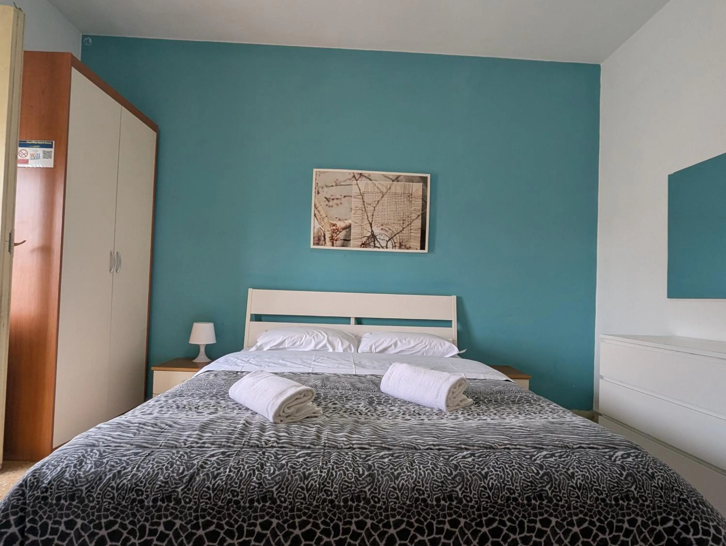 Bed in Pearl Pisa guest house