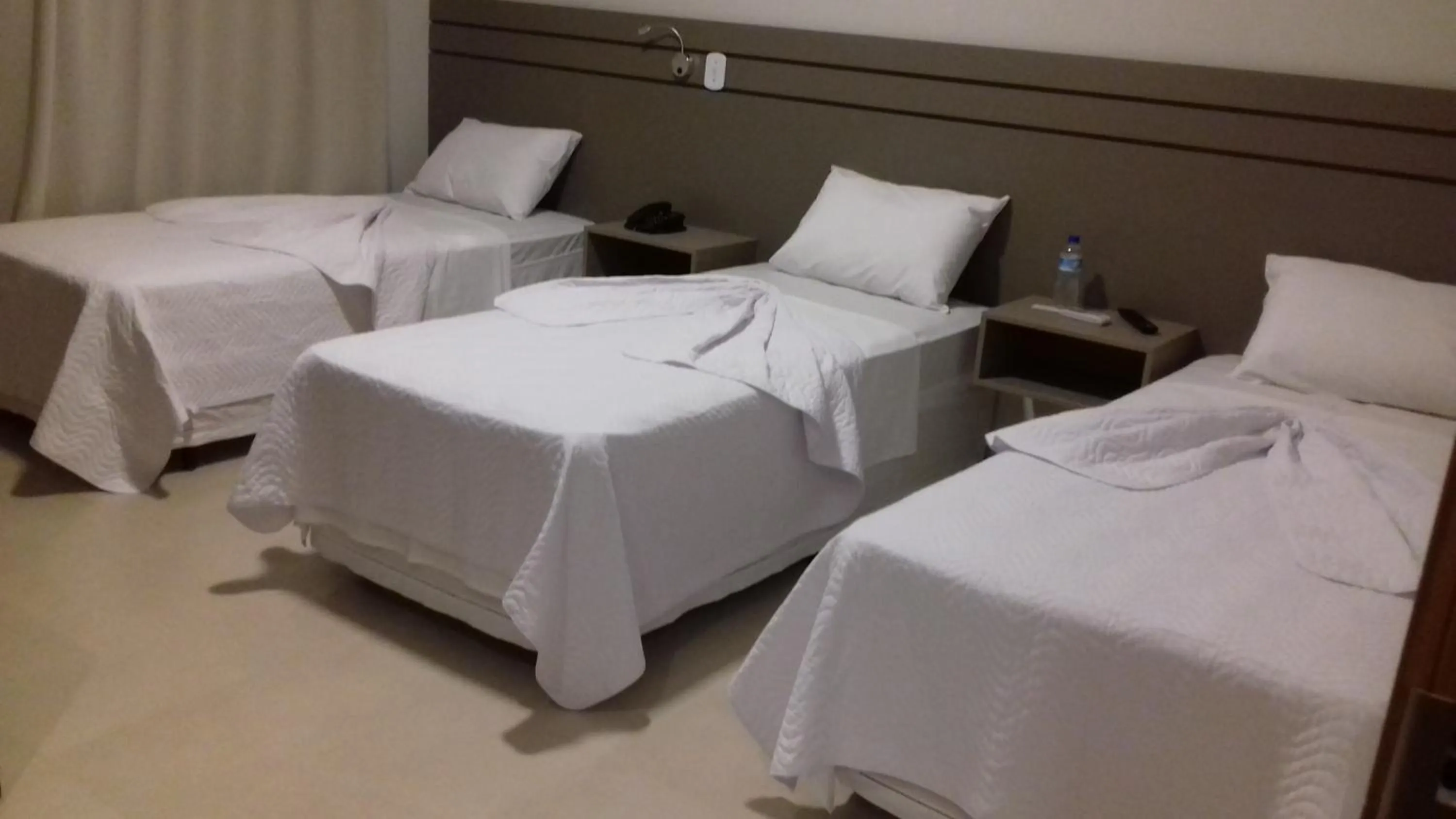 Bed in Pak Suítes Hotel