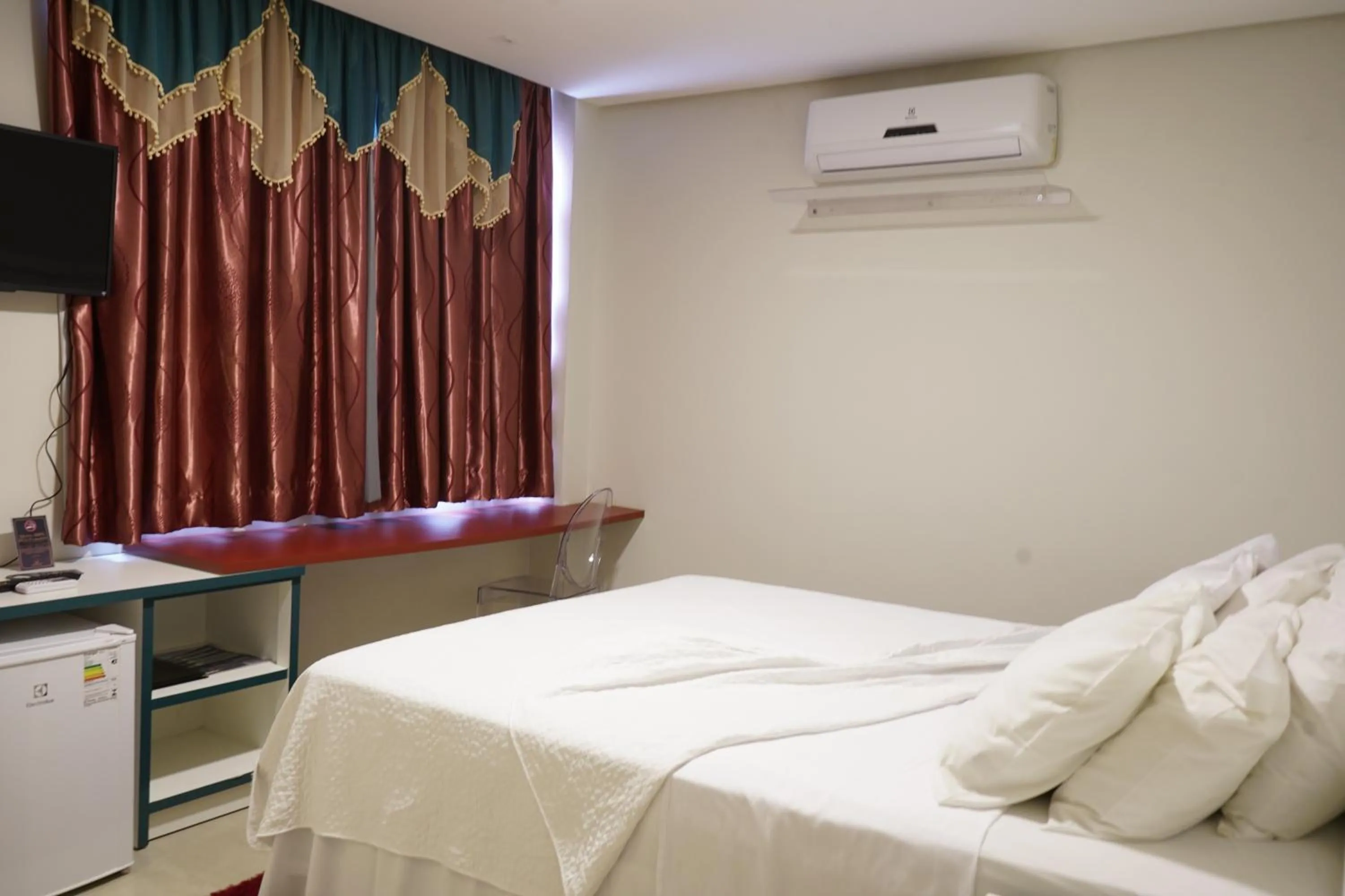 Bed in Pak Suítes Hotel