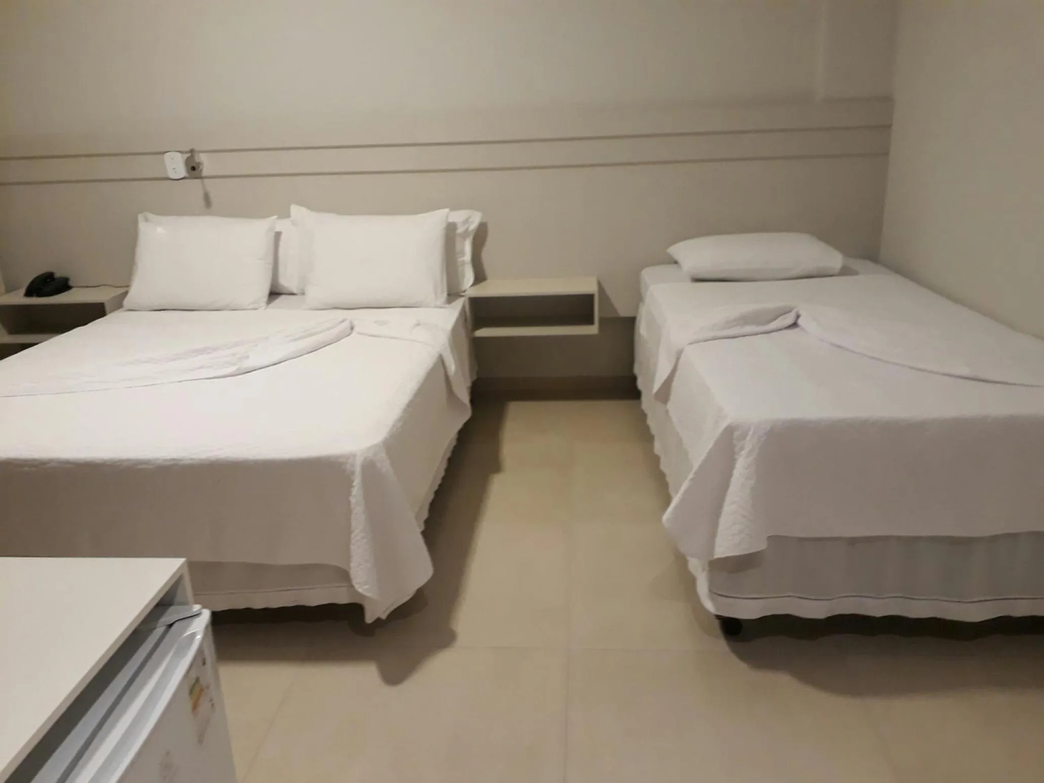 Bed in Pak Suítes Hotel