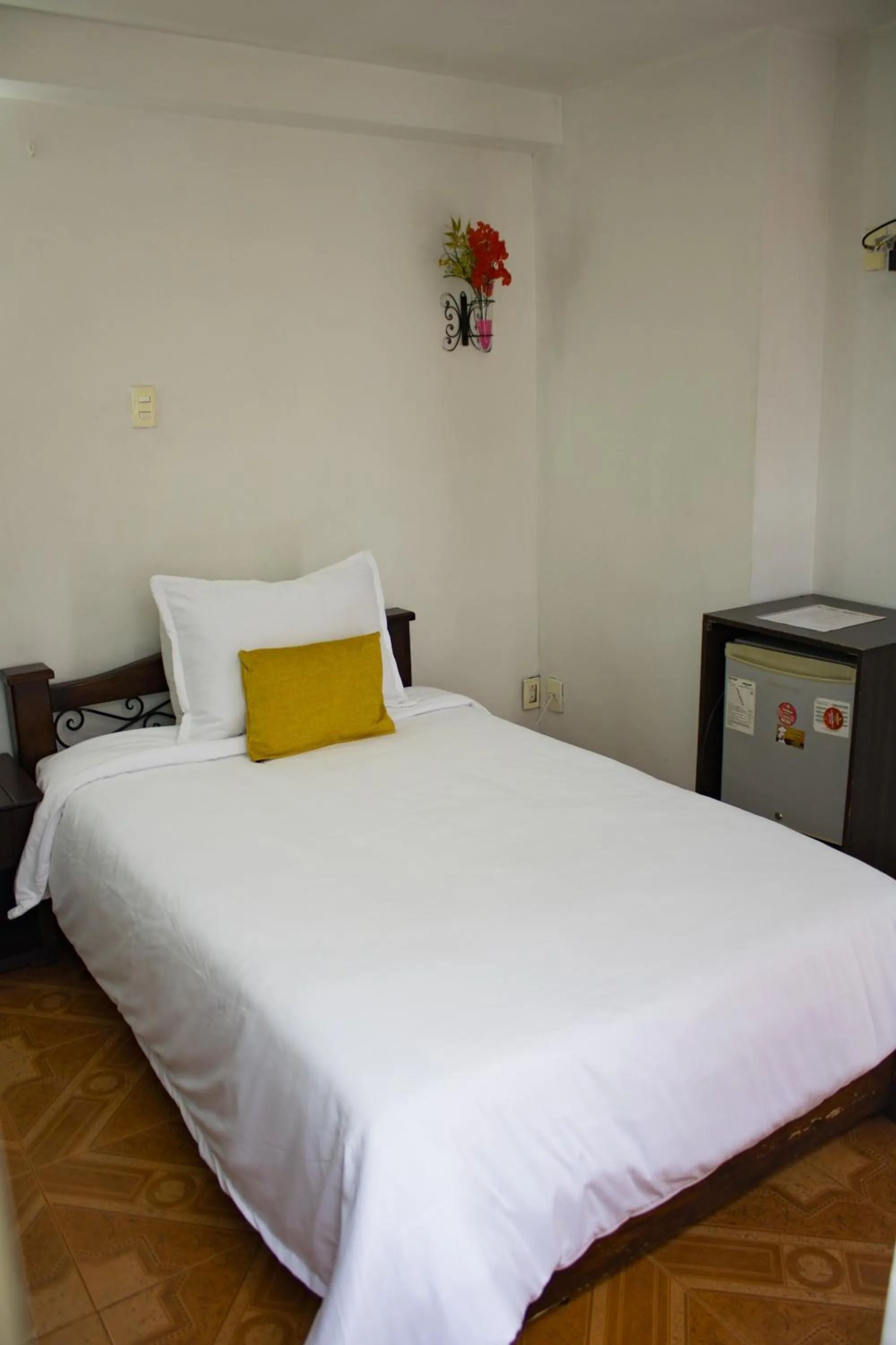 Bed in Hotel Royal Suite