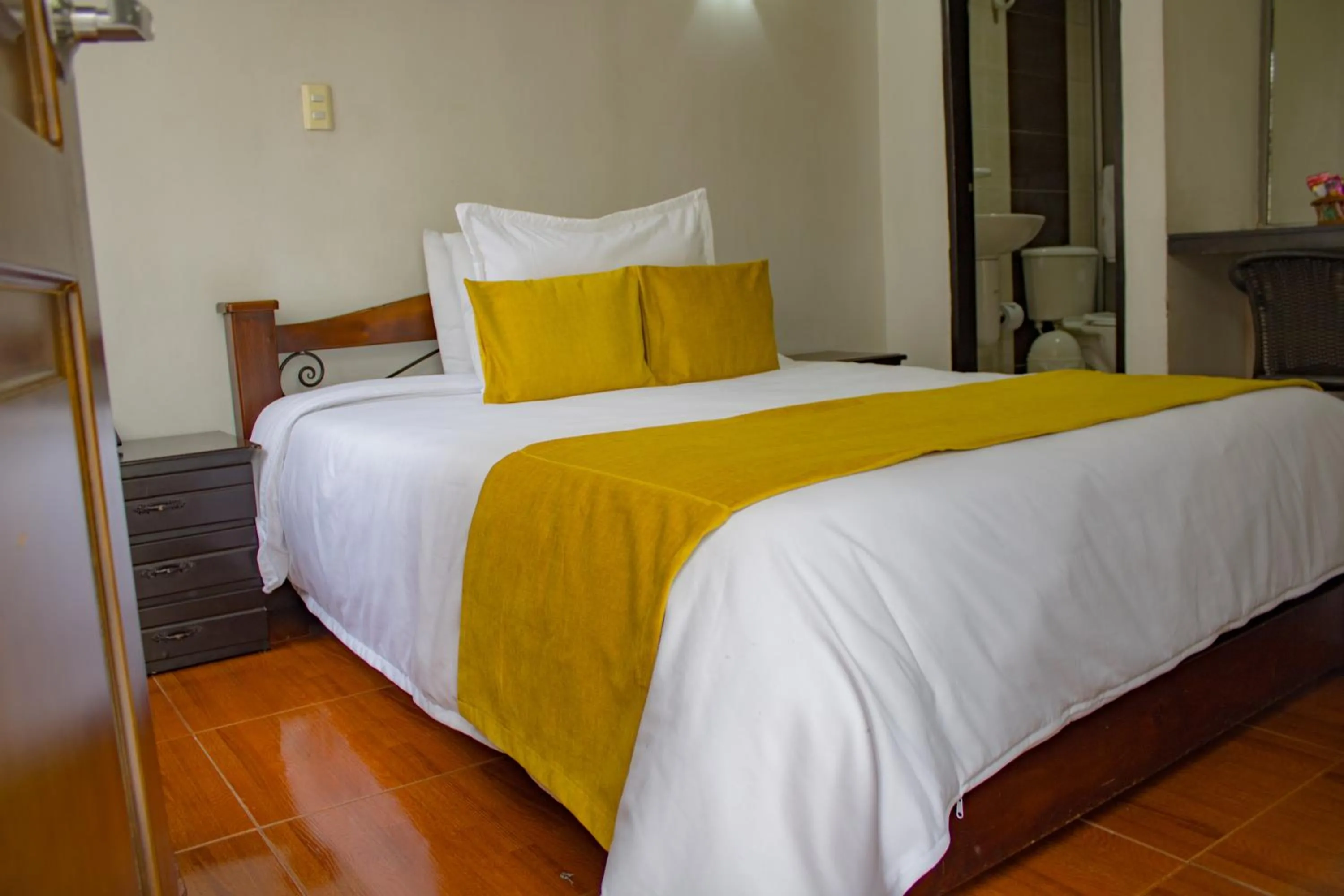 Bed in Hotel Royal Suite