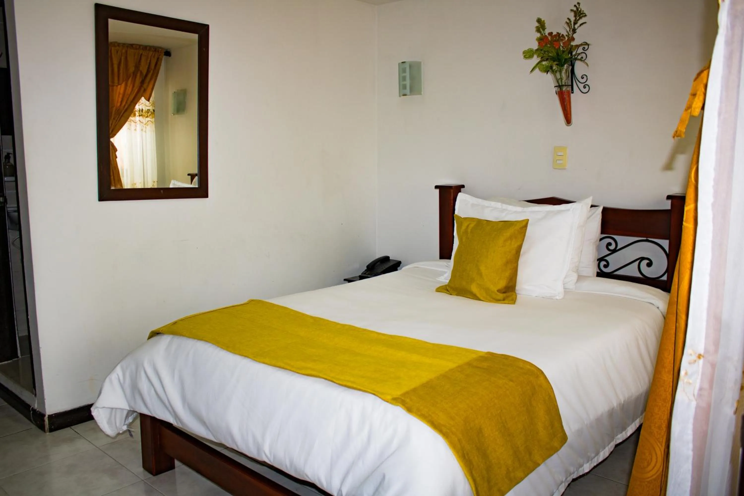Bed in Hotel Royal Suite