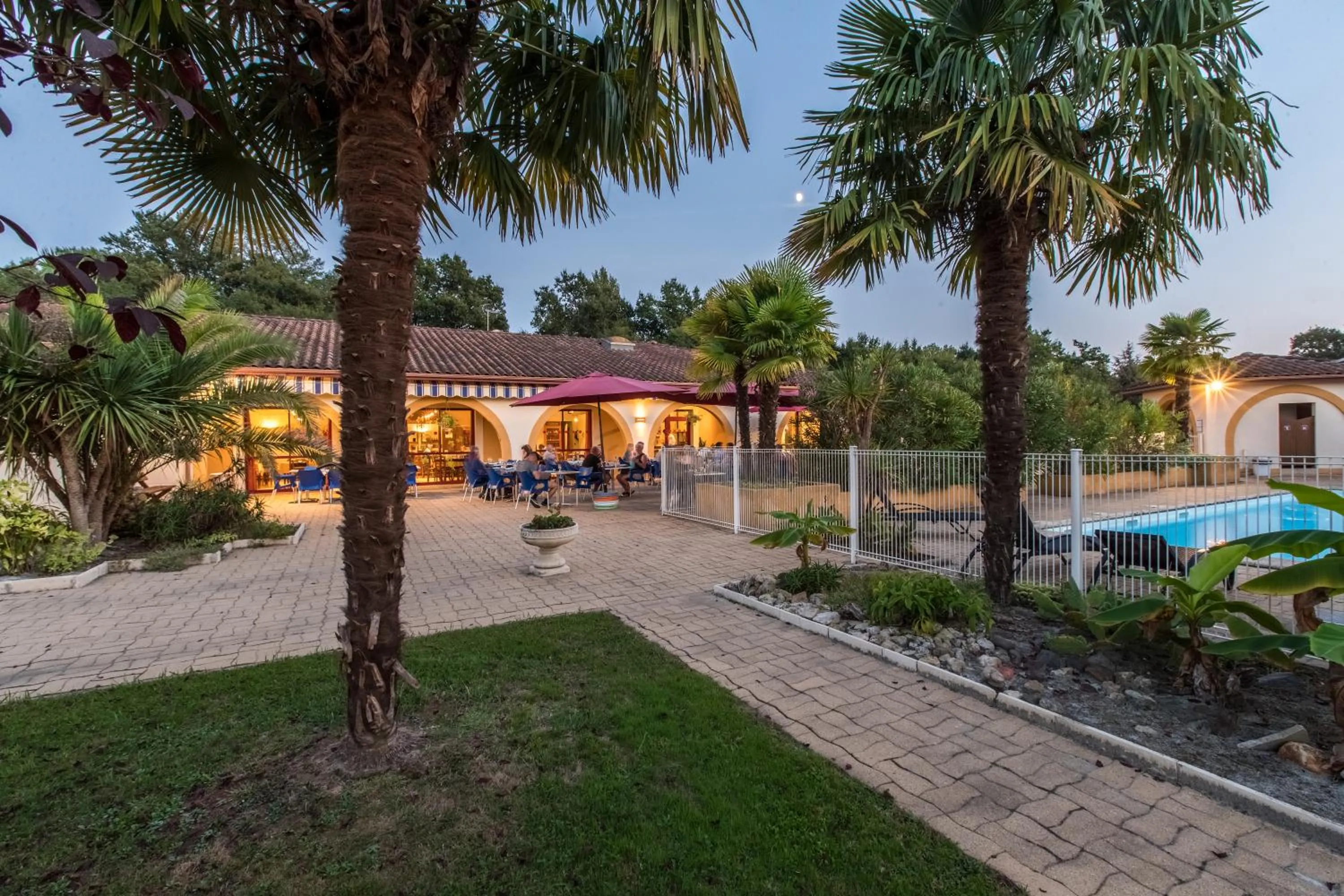 Garden in Logis Hôtel Restaurant Solenca