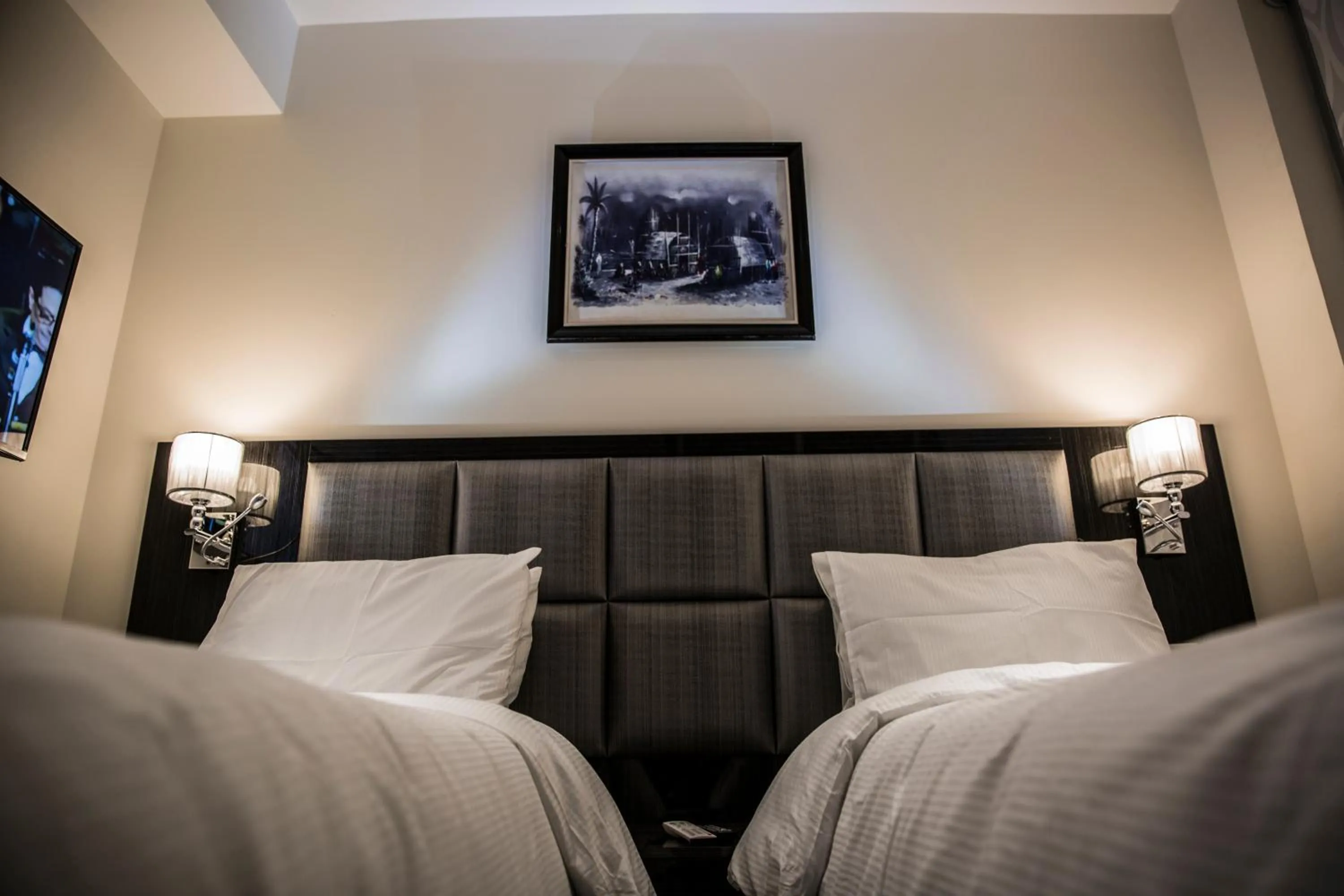 Bed in Naylover Hotel Suites