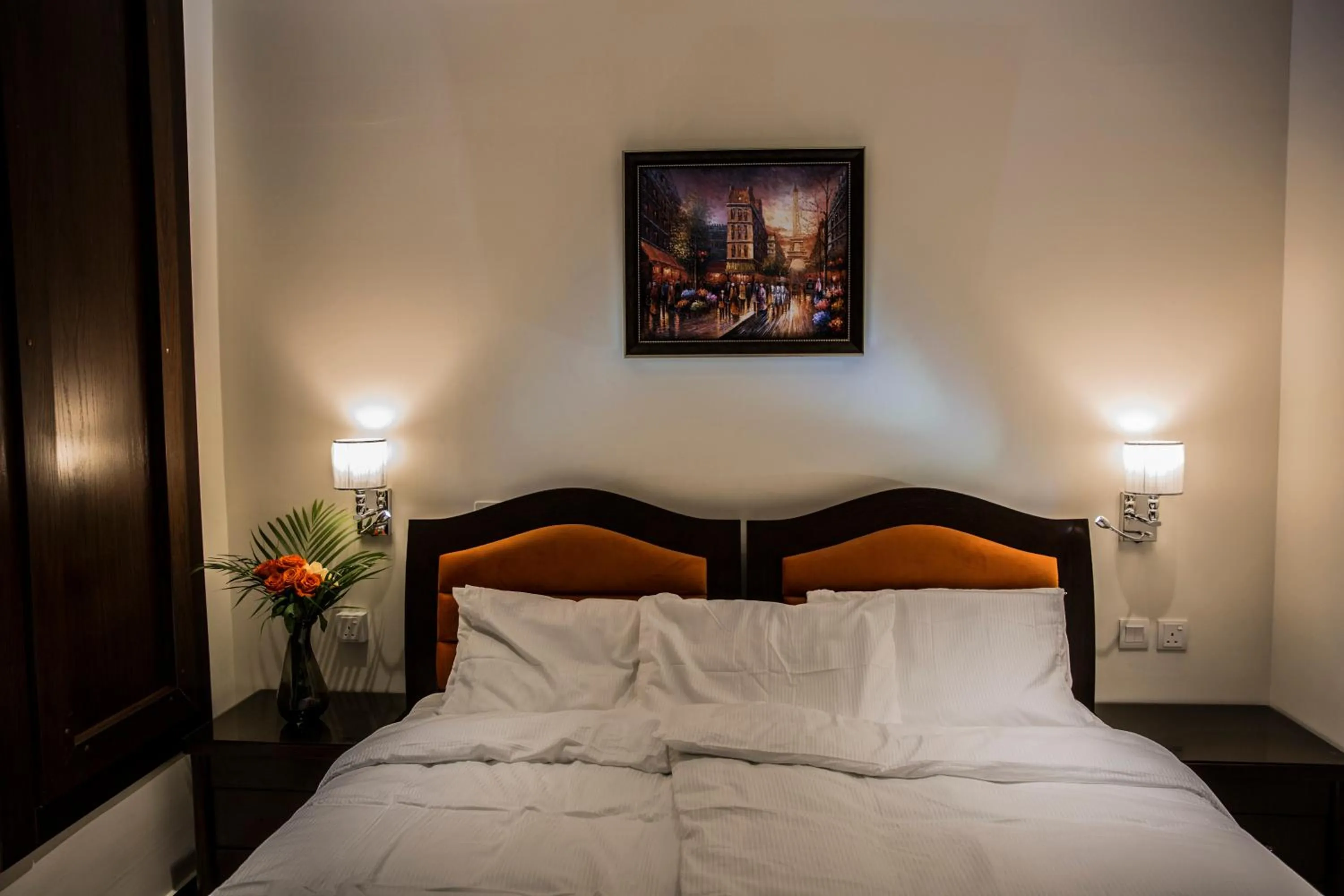 Bed in Naylover Hotel Suites