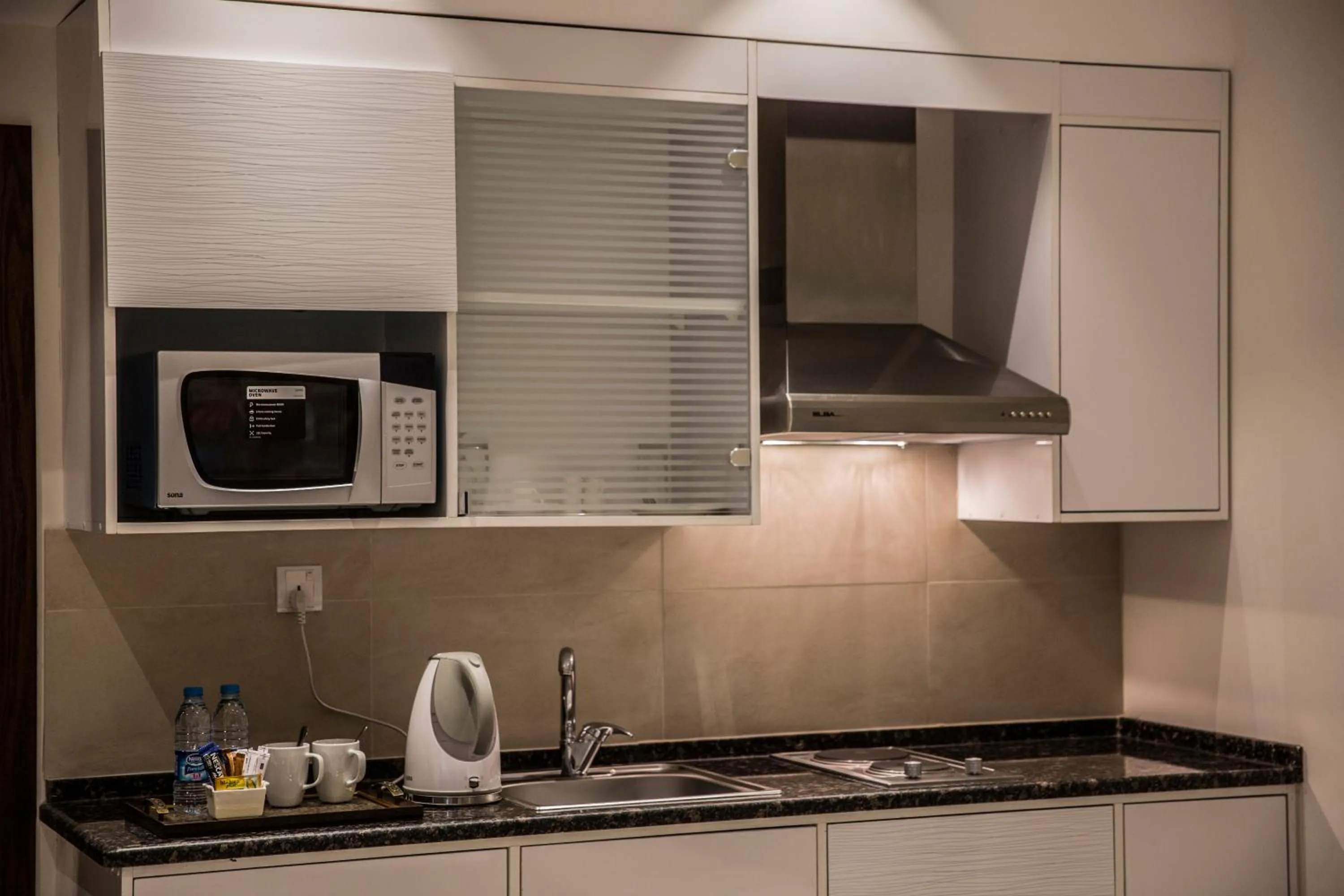 Kitchen or kitchenette in Naylover Hotel Suites