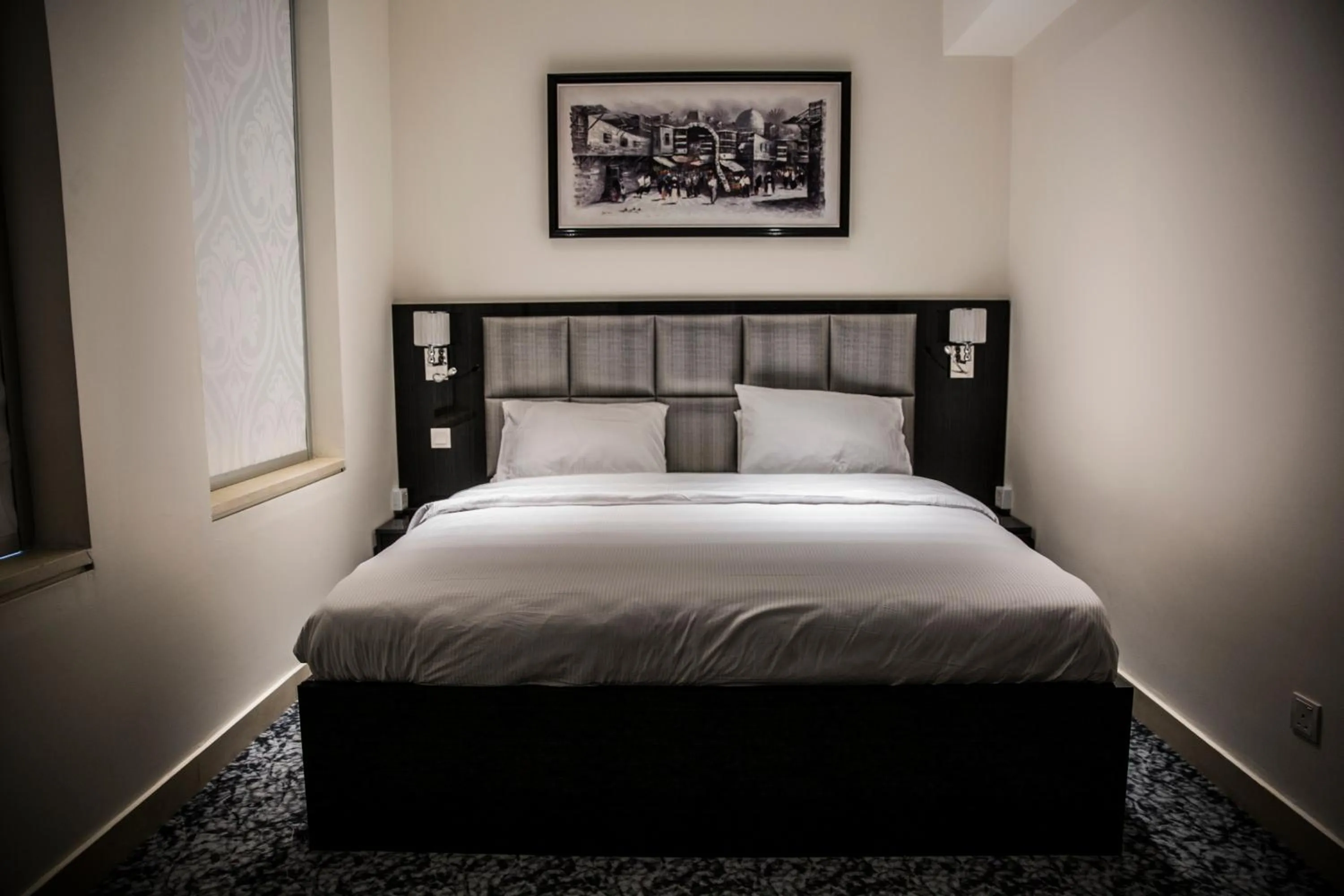 Bed in Naylover Hotel Suites