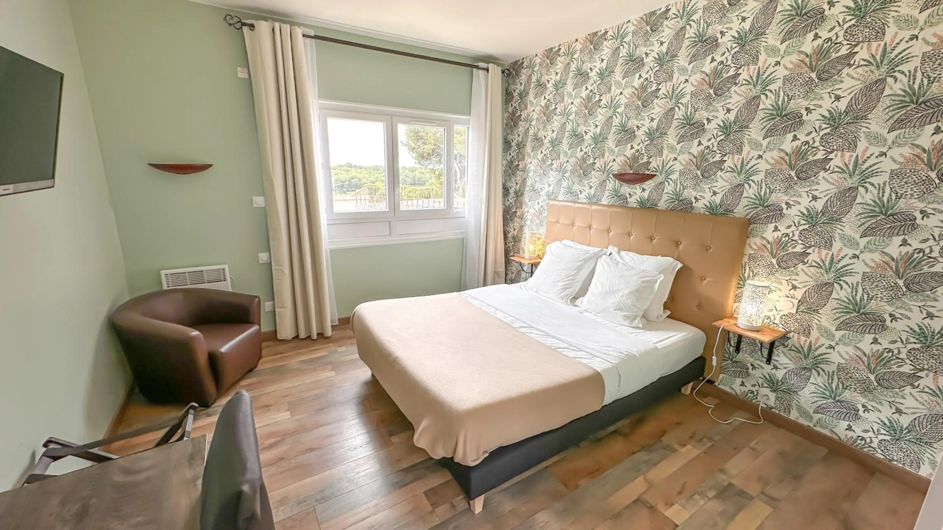 Bed in Hotel Les Rocailles