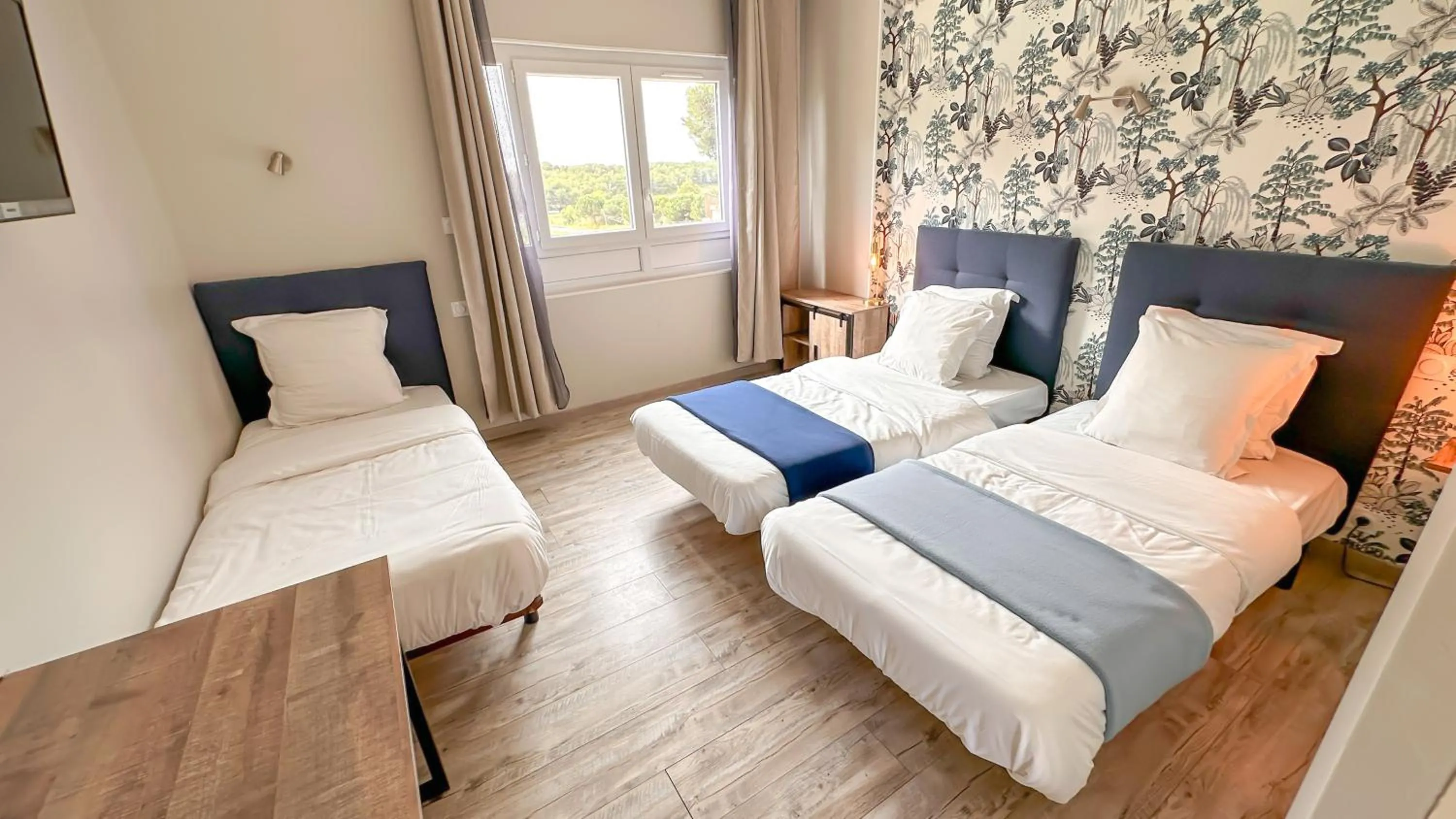 Bed in Hotel Les Rocailles