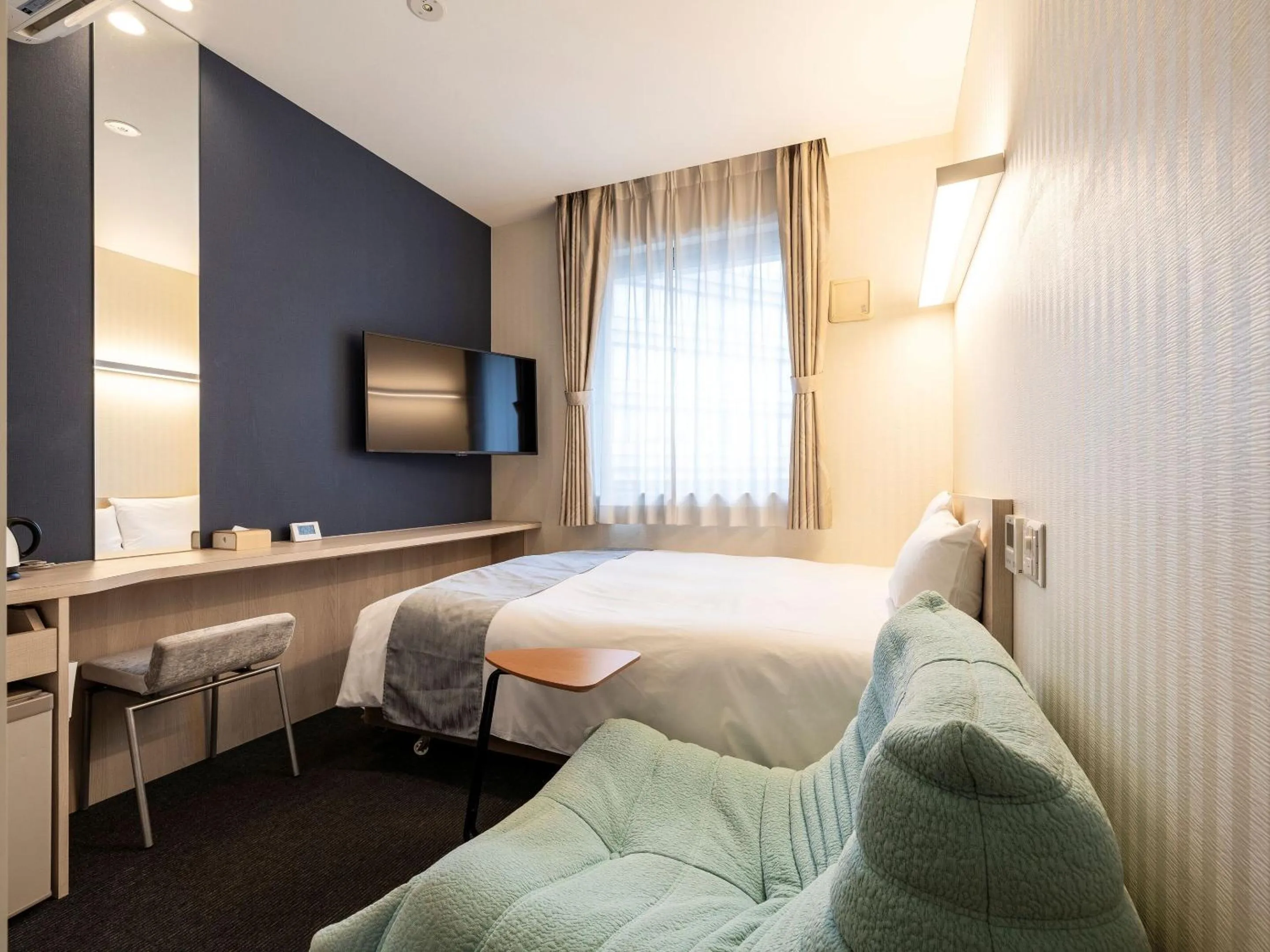 Photo of the whole room, Bed in KOKO HOTEL Hakata Shinkansenguchi - formerly Hotel Wing International Hakata Shinkansenguchi