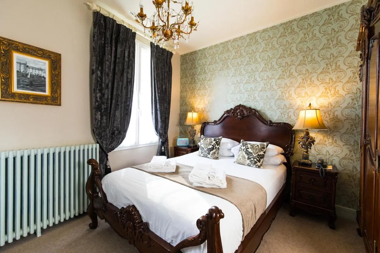 Bed in Logis Hotel De France