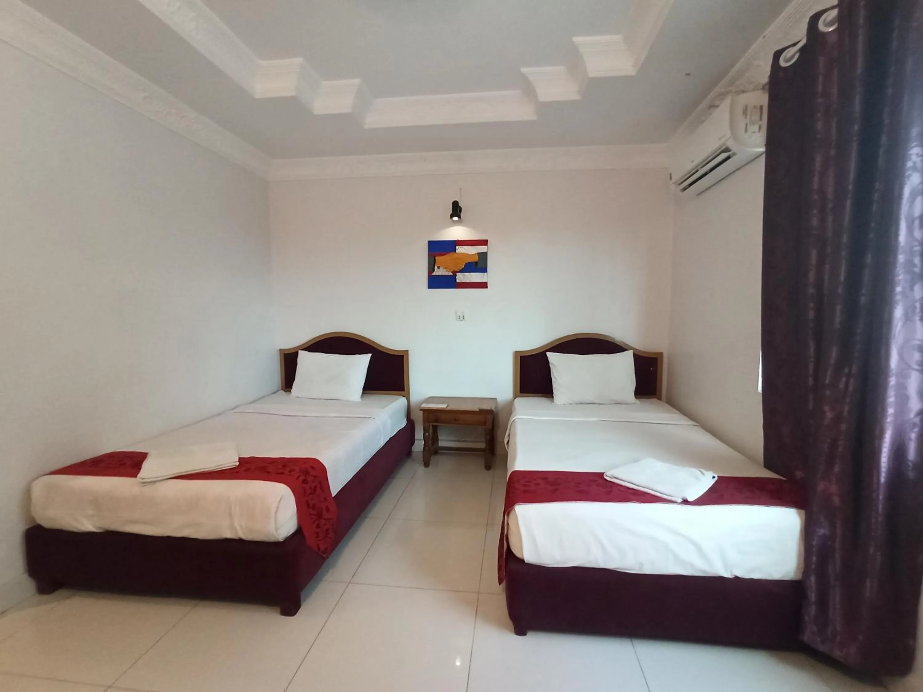 Bed in PAMA Hotel