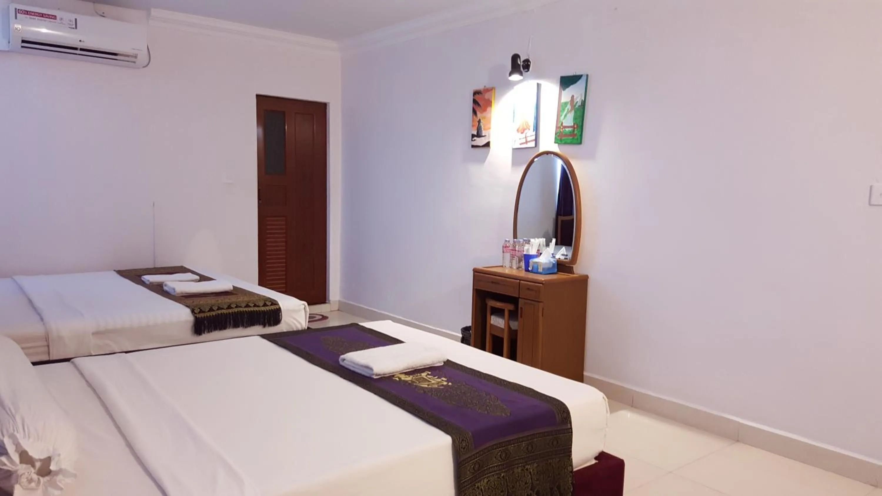 Bed in PAMA Hotel