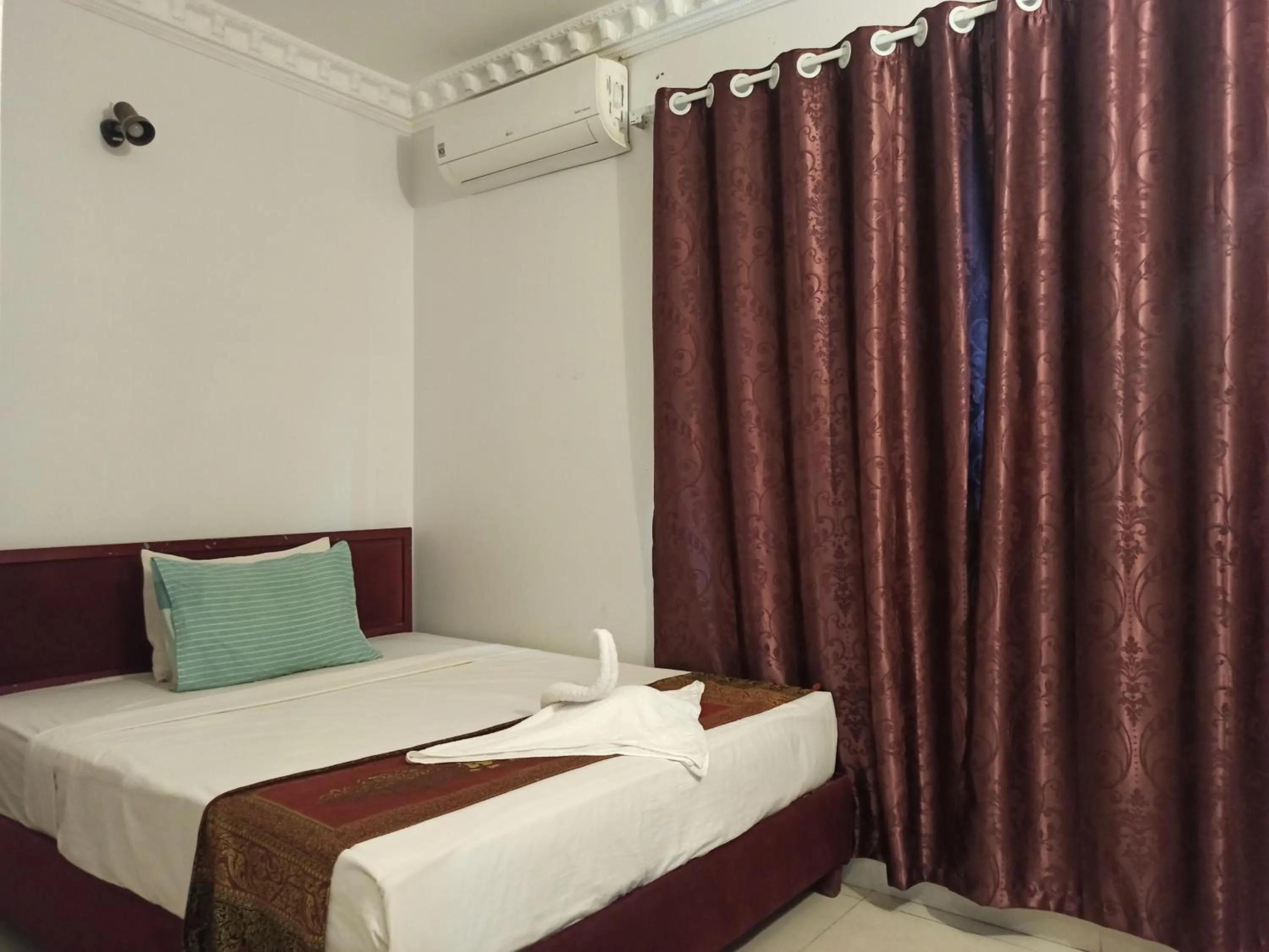 Bed in PAMA Hotel