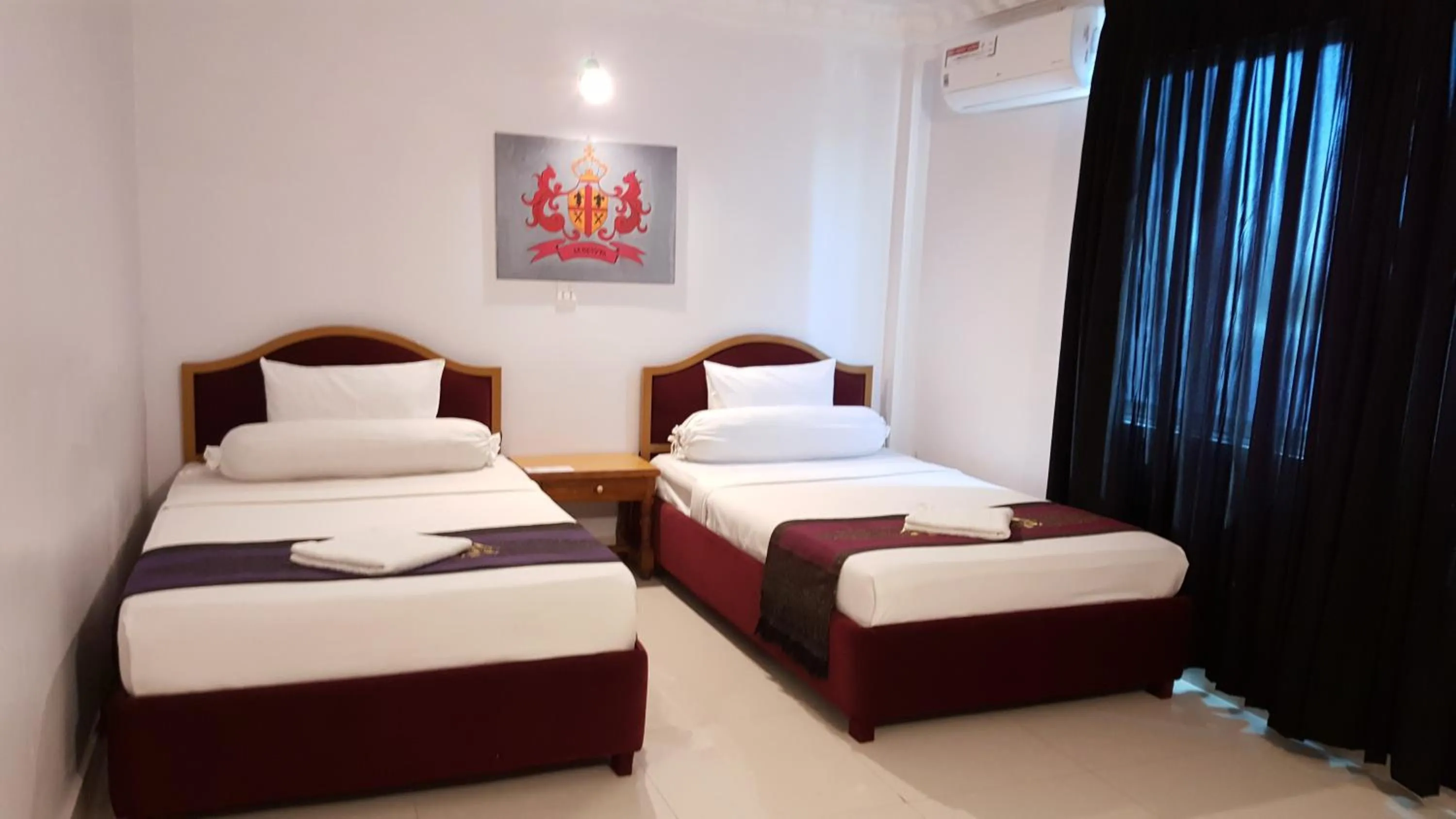 Bed in PAMA Hotel