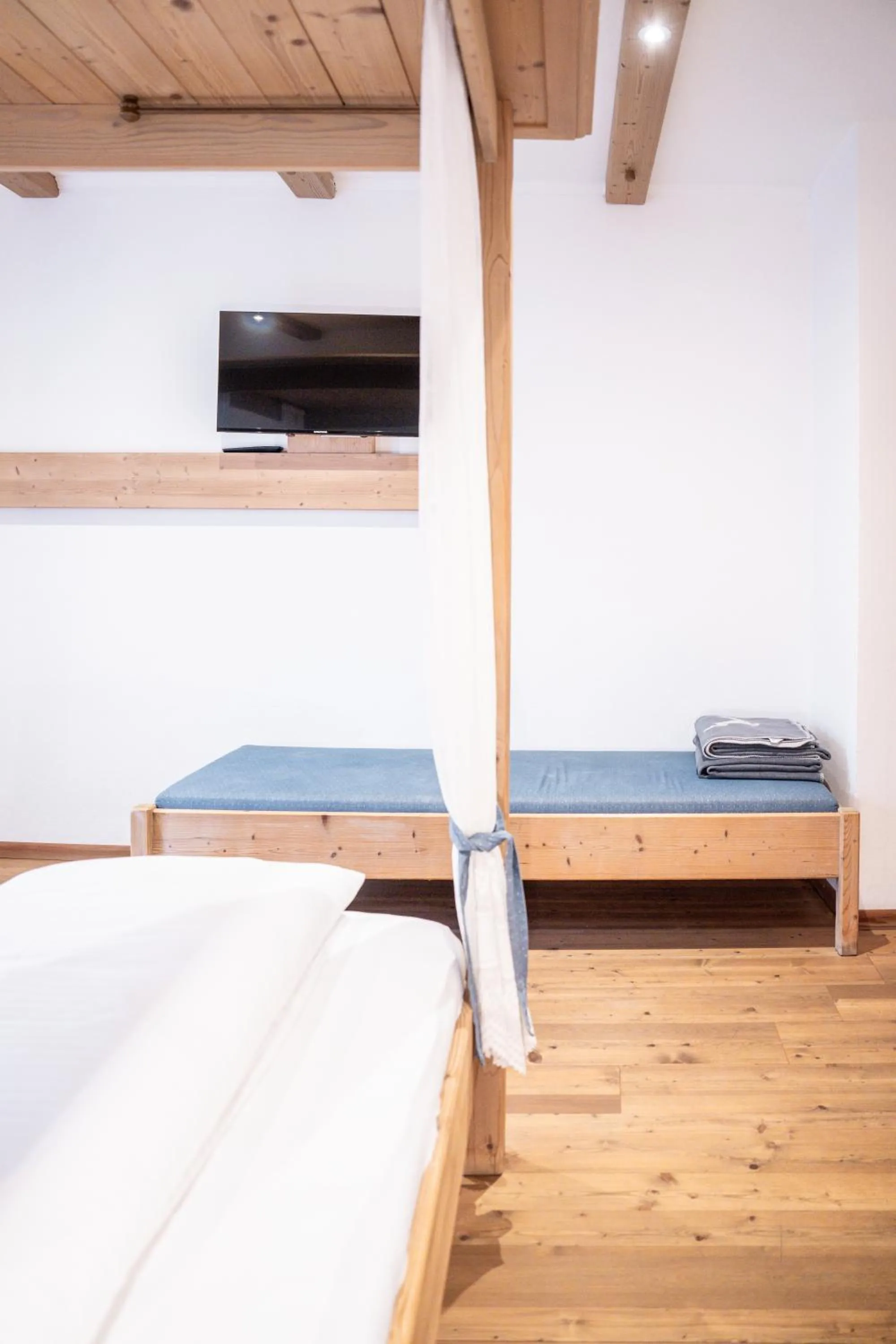 Bed in Stauders Zimmer und Ferienwohnungen