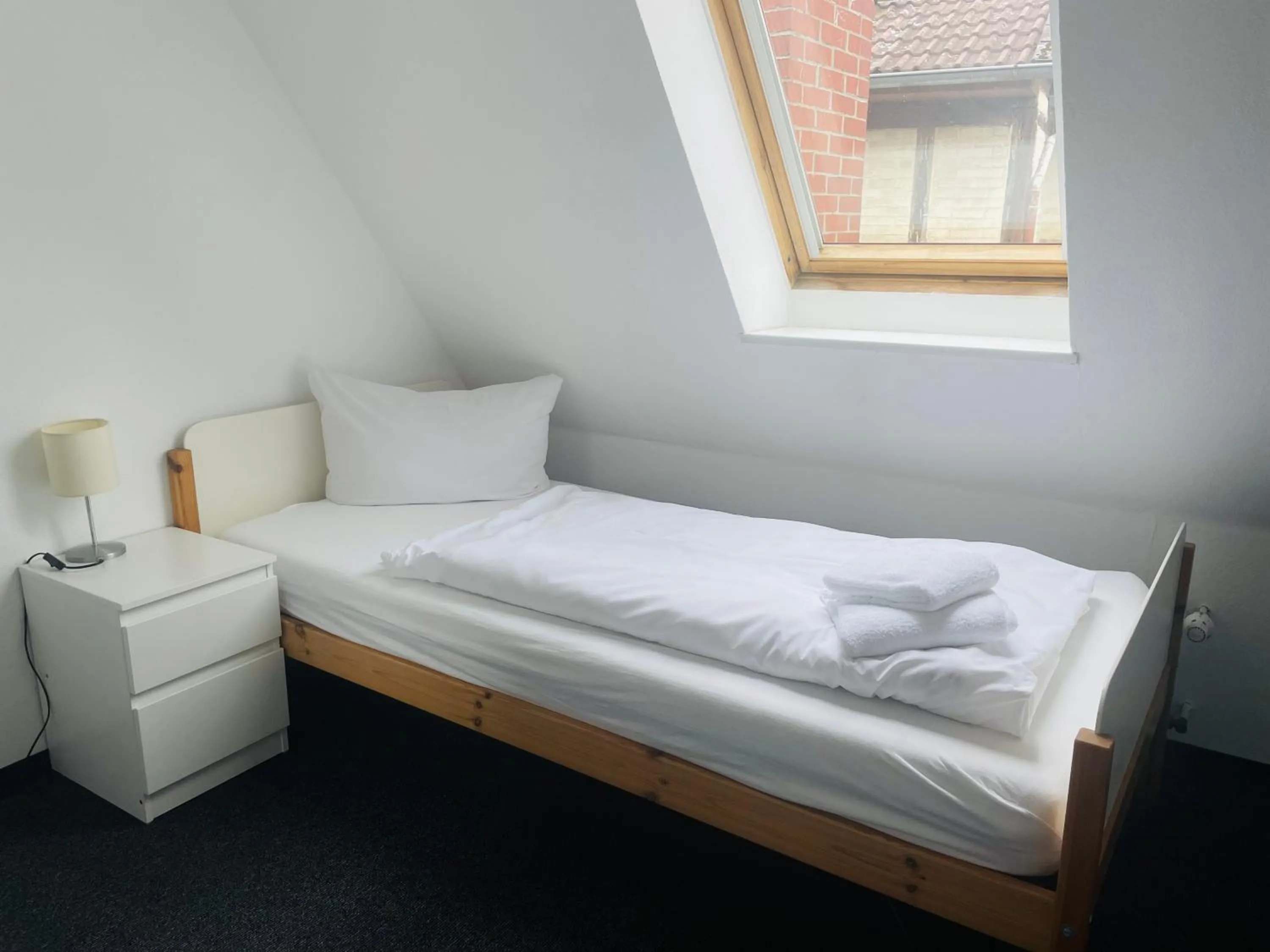 Bed in MARKT EINS Gästezimmer