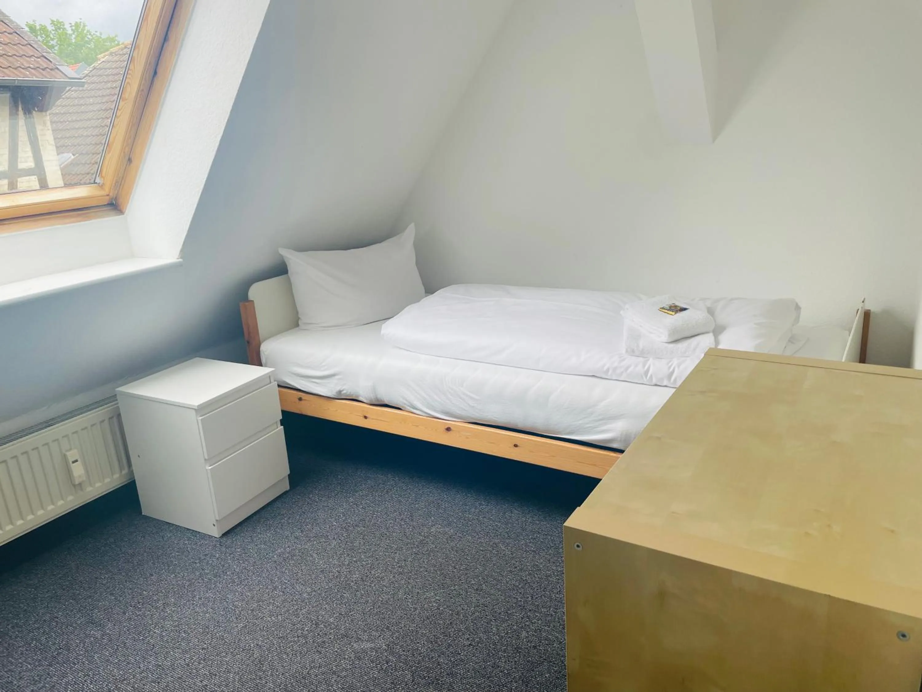 Bed in MARKT EINS Gästezimmer