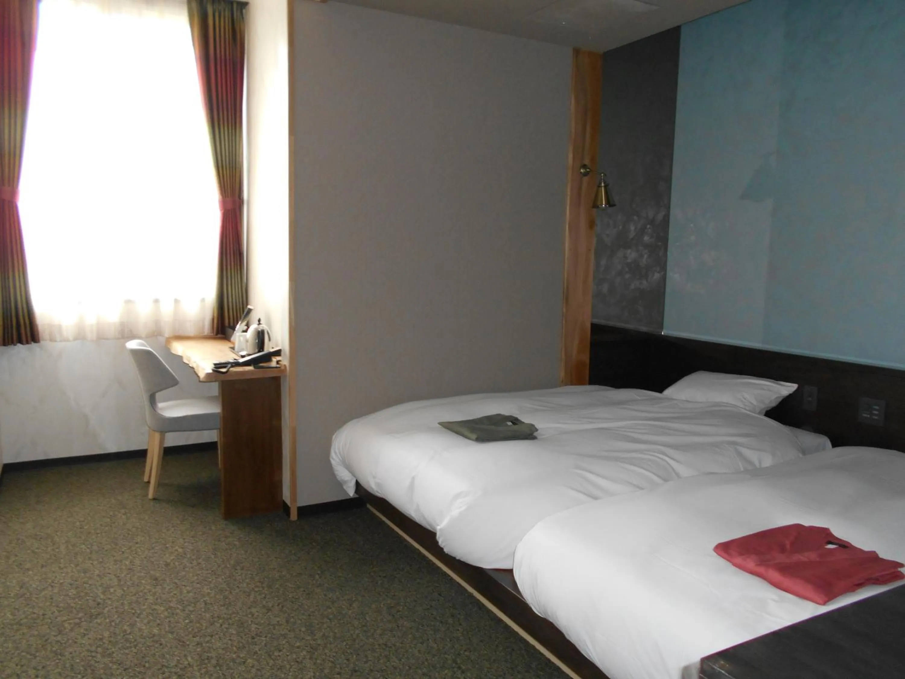 Bed in Kojohama Onsen Hotel