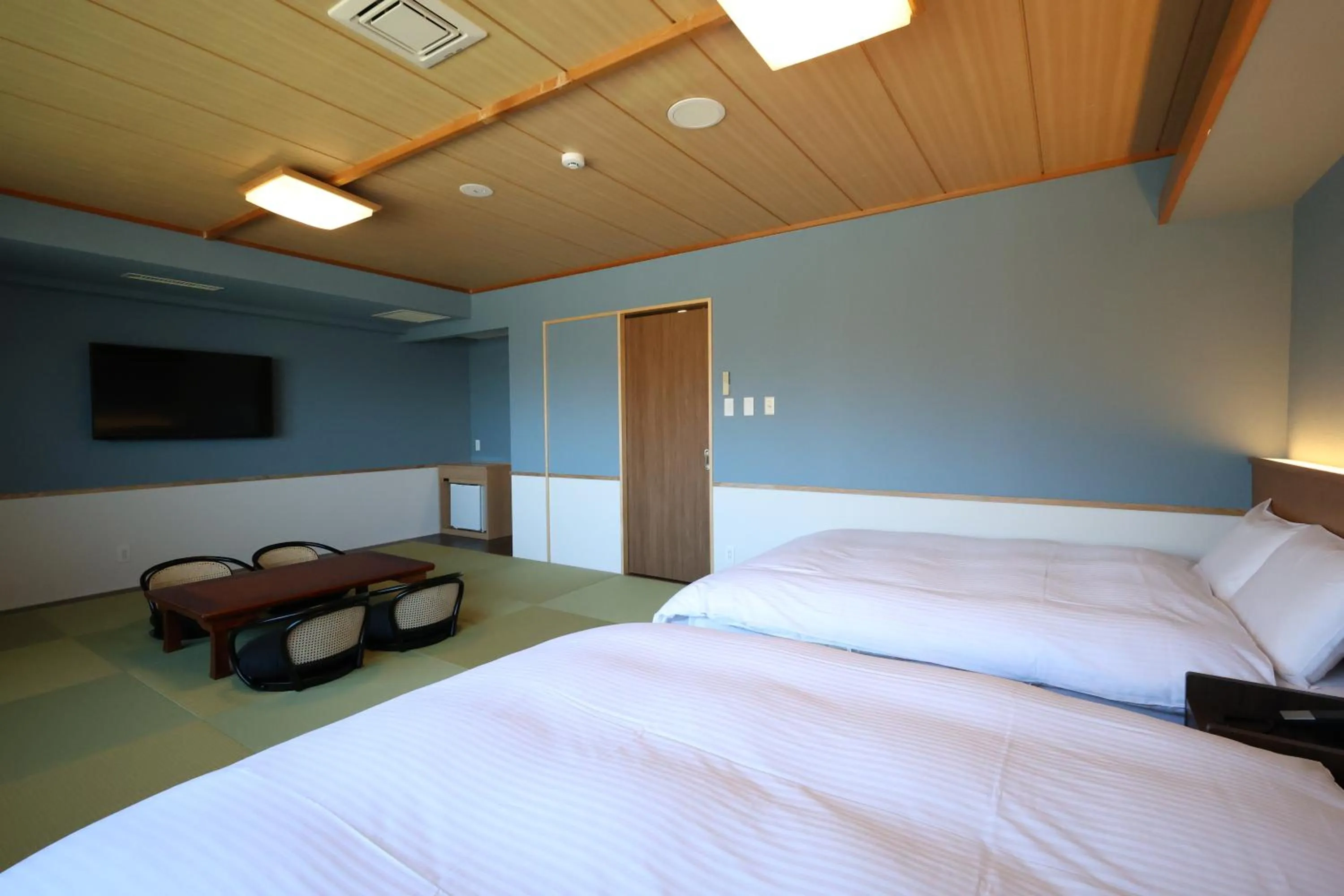 Bed in Kojohama Onsen Hotel