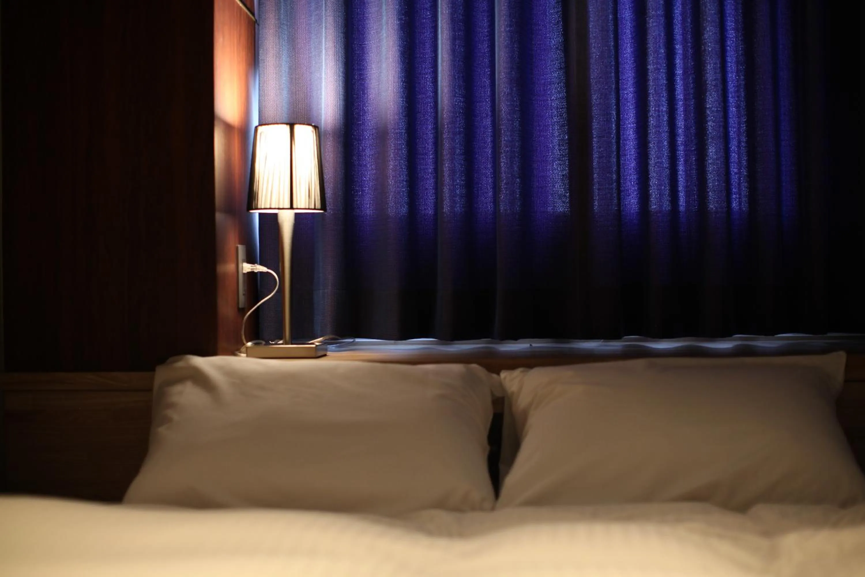 Bed in Kojohama Onsen Hotel