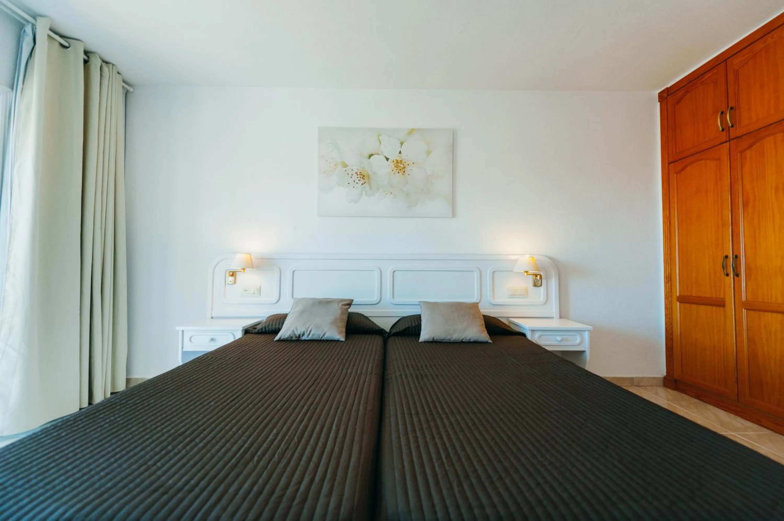 Bed in Aparthotel Neptuno Costadeje