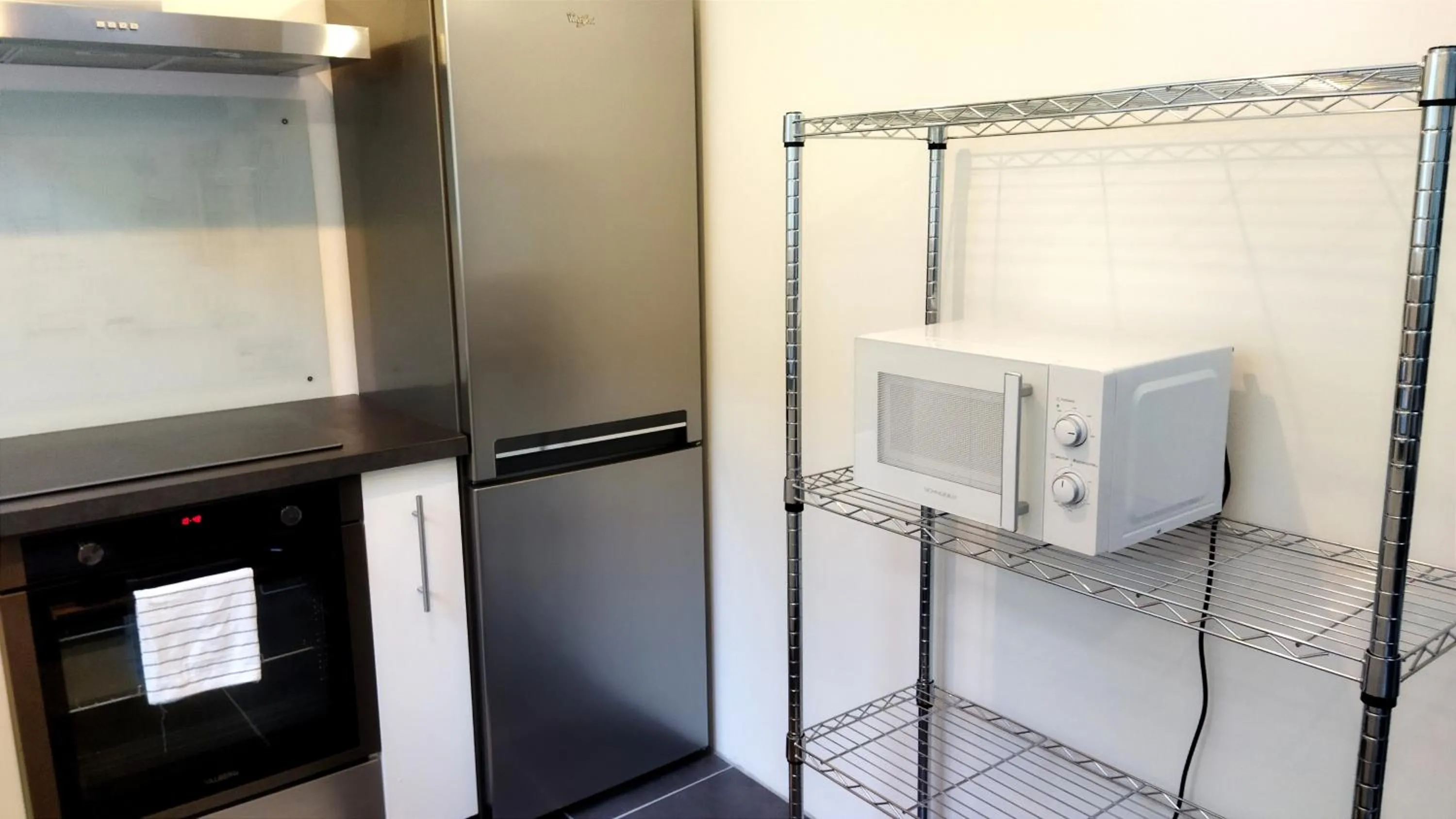 Kitchen or kitchenette in Appartements Les remparts d'Alienor