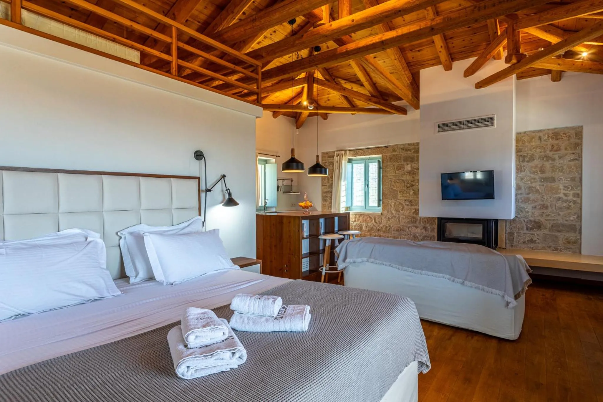 Bed in Lithos Guesthouse Kardamili