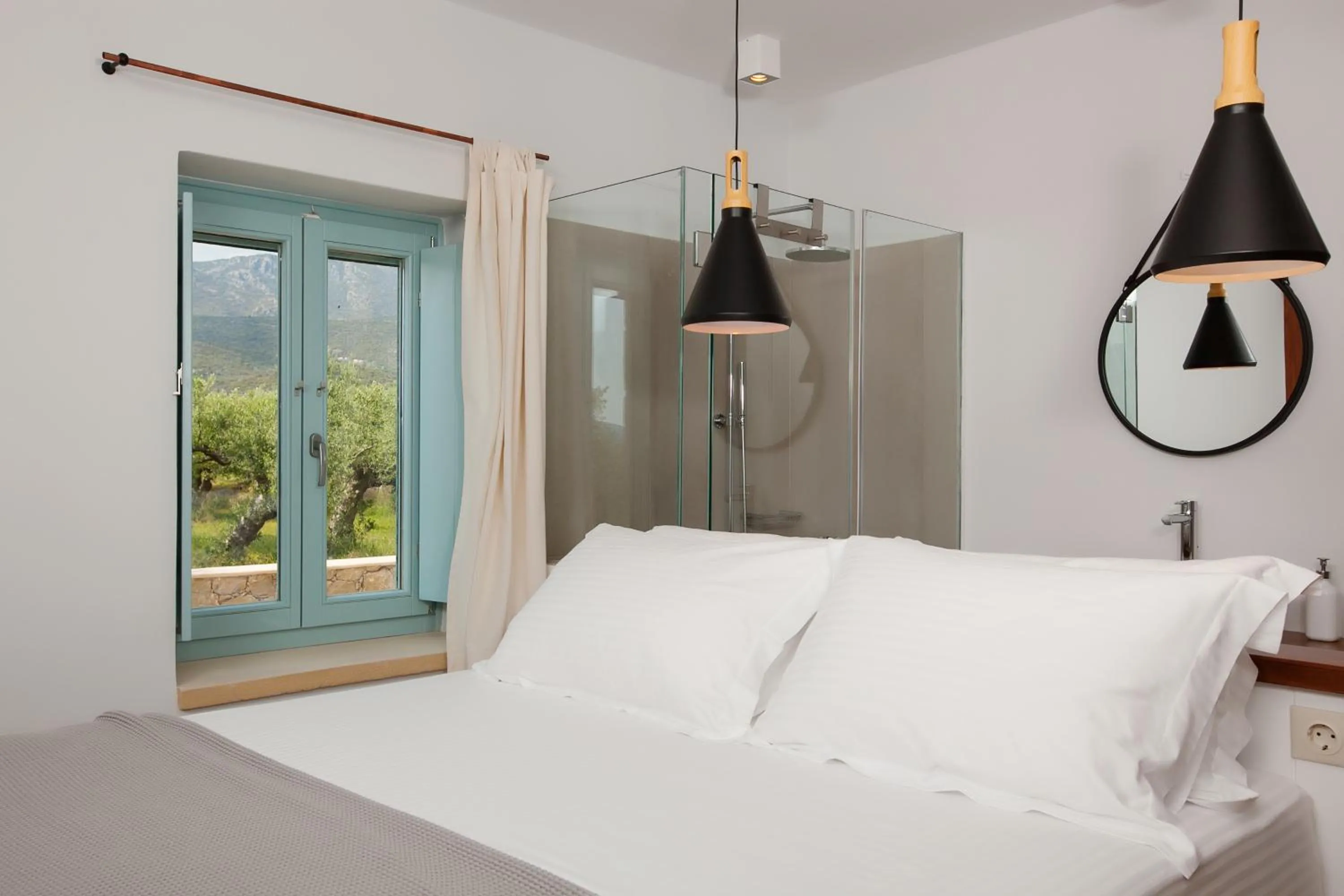 Bed in Lithos Guesthouse Kardamili