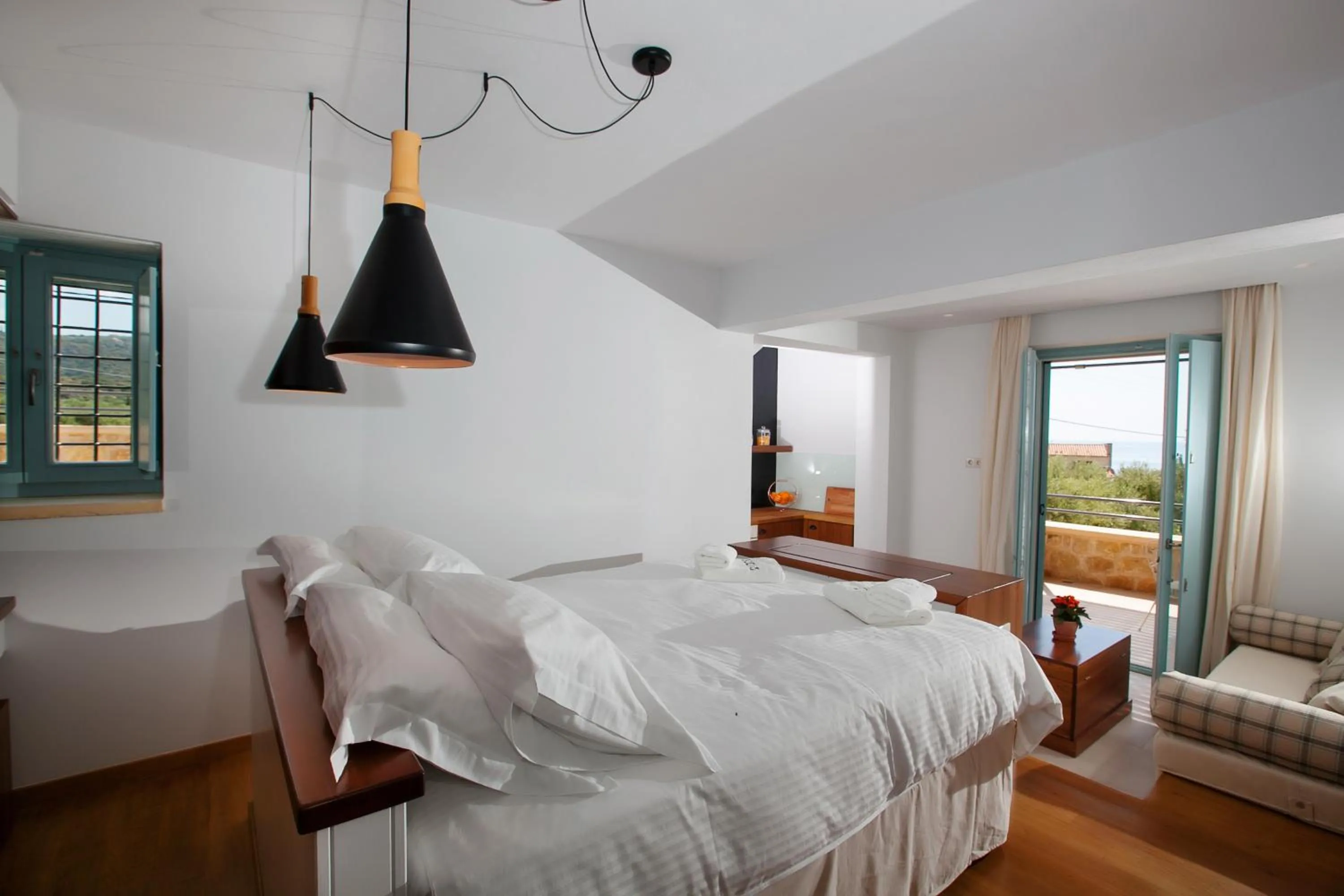 Bed in Lithos Guesthouse Kardamili