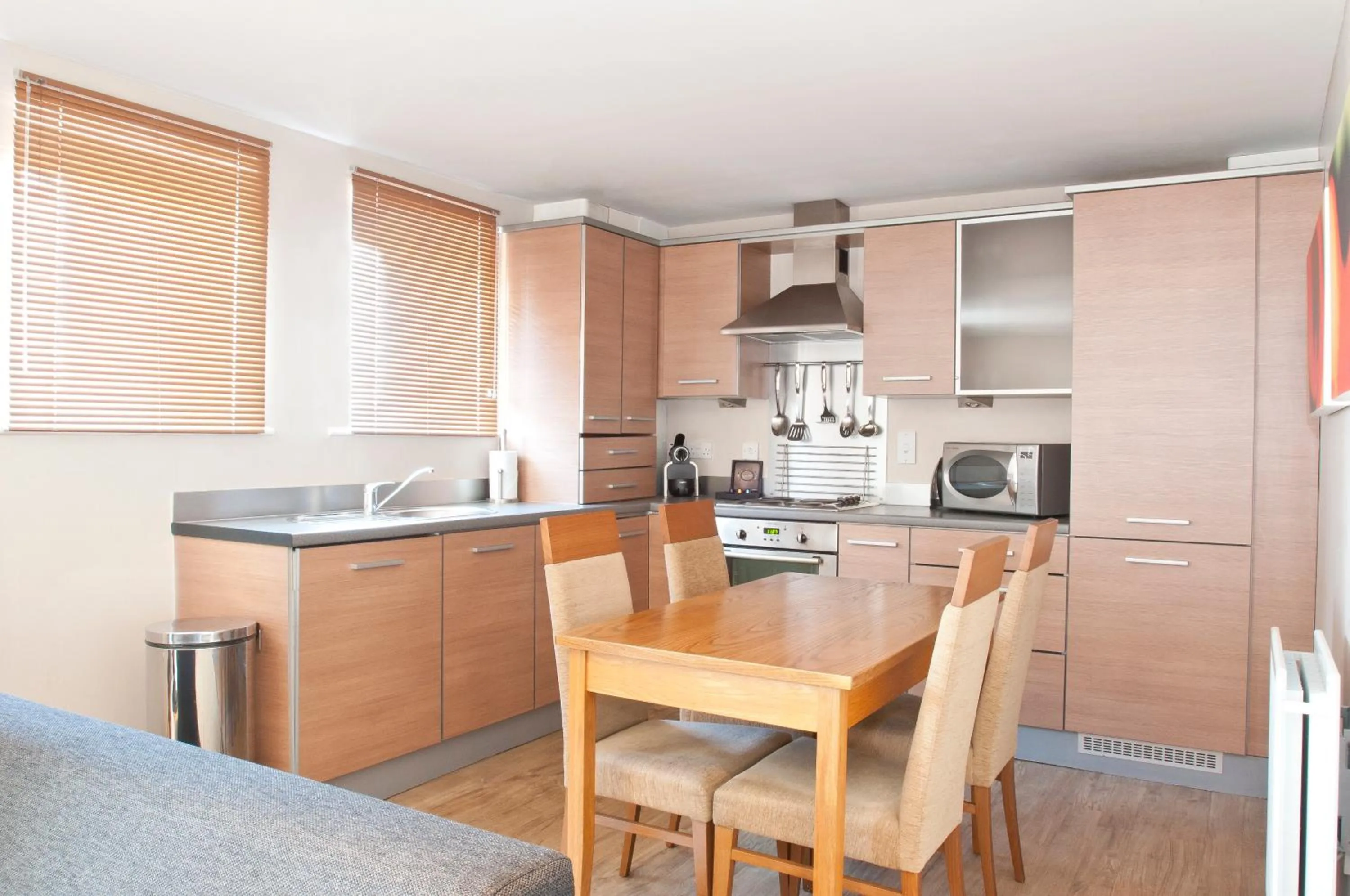 Kitchen or kitchenette in PREMIER SUITES Newcastle