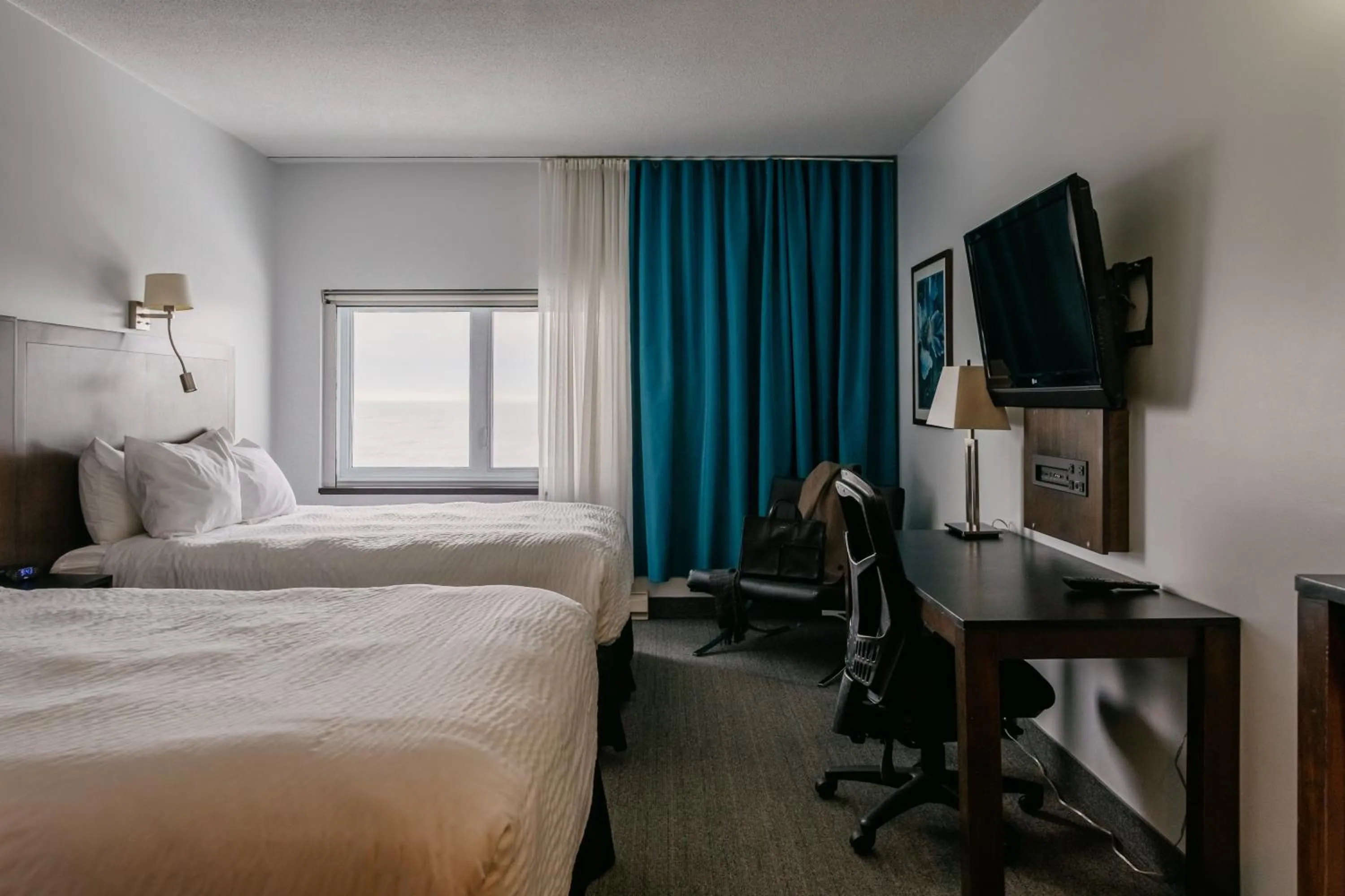 Photo of the whole room, Bed in Riotel Matane