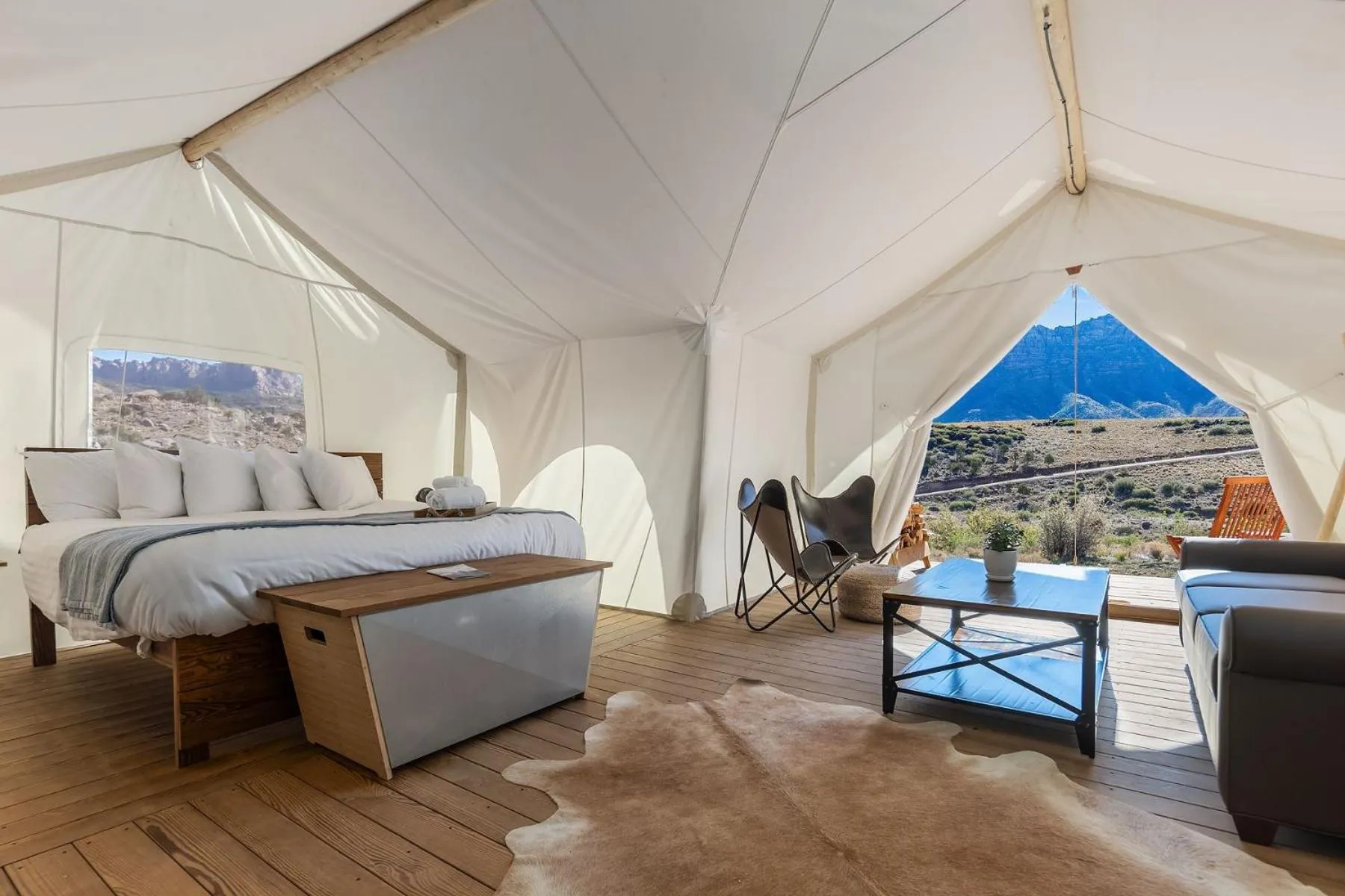 Seating area, Bed in Under Canvas Zion