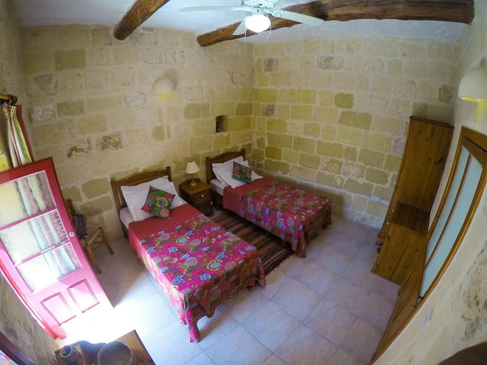 Photo of the whole room, Bed in Shanti Ghar Gozo