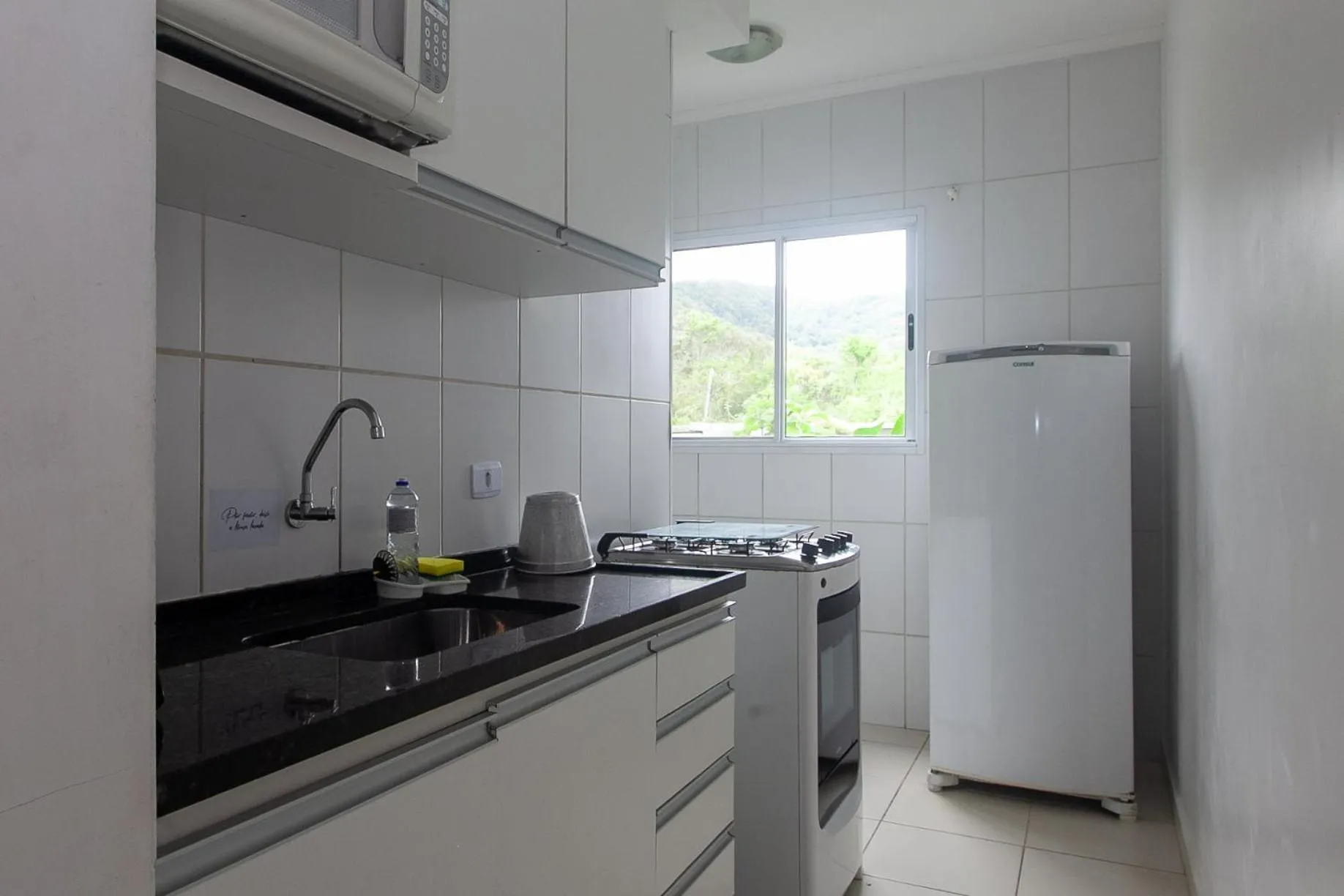 kitchen in Apartamento Erica Itaguá proximo da Praia Grande