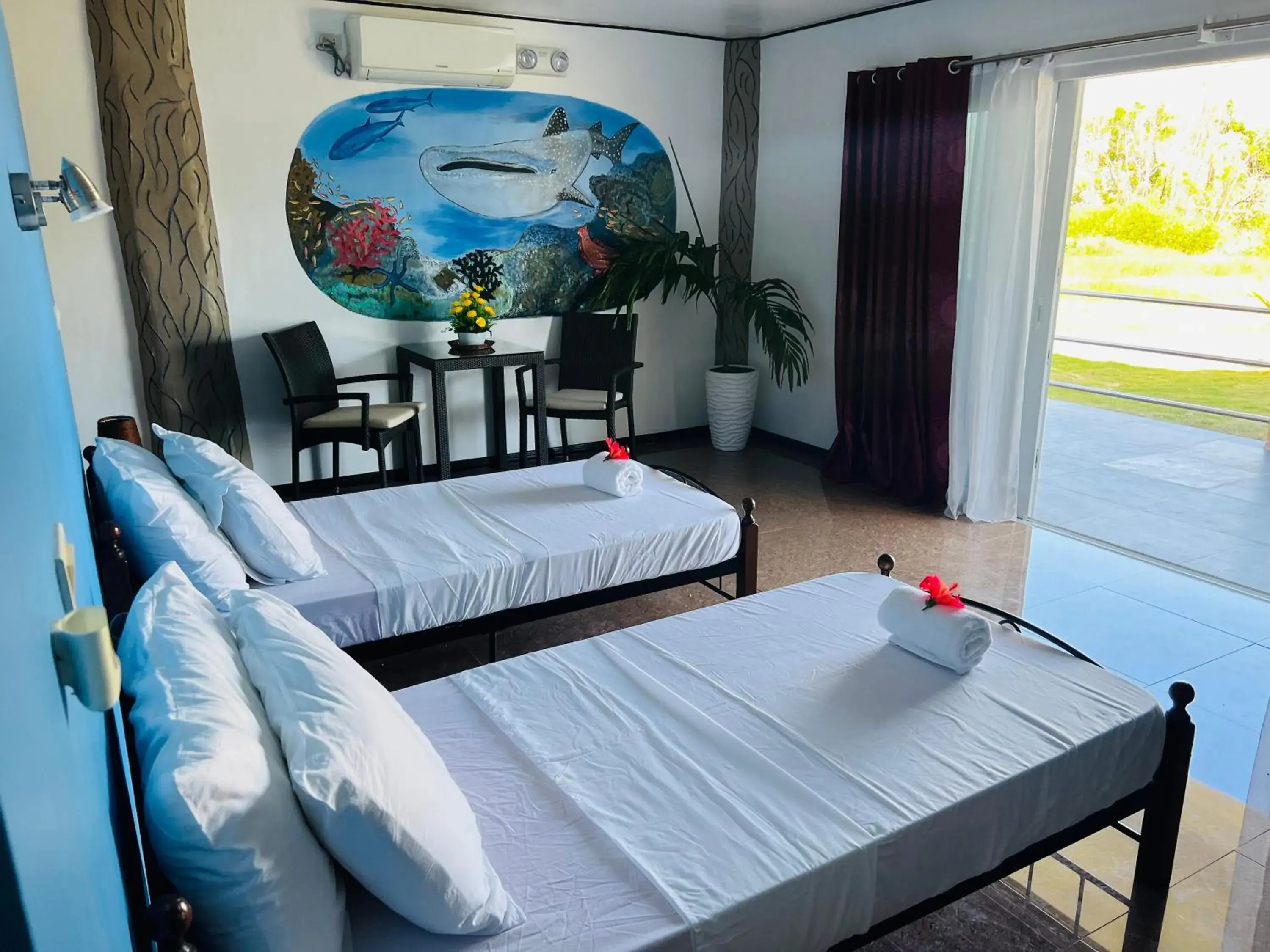 Deluxe Bungalow with Garden View in Cabilao Sunset Dive & Beach Resort Deluxe Bungalow with Garden View in Cabilao Sunset Dive & Beach Resort