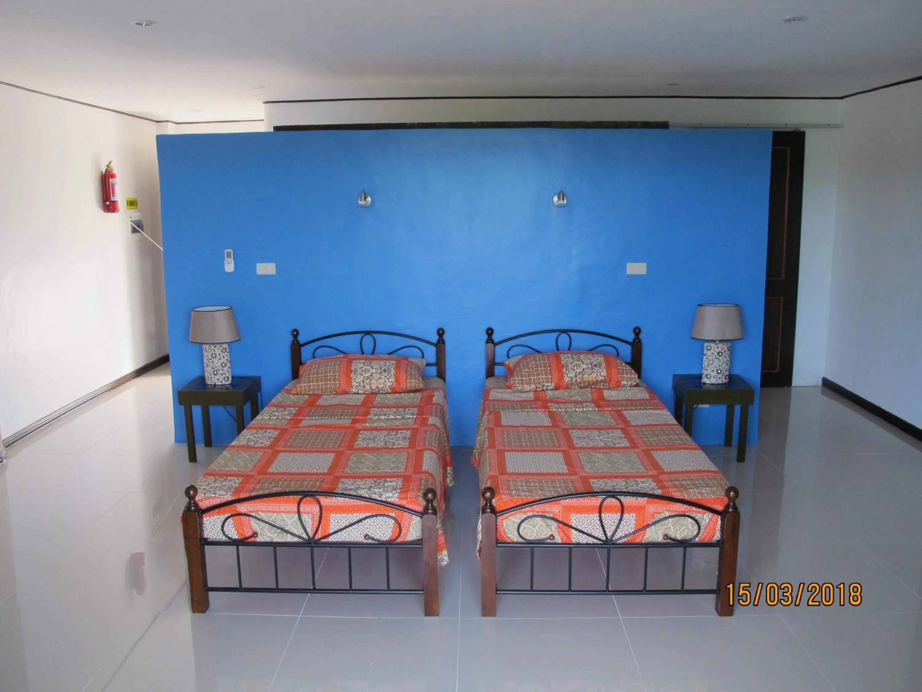 Bed in Cabilao Sunset Dive & Beach Resort