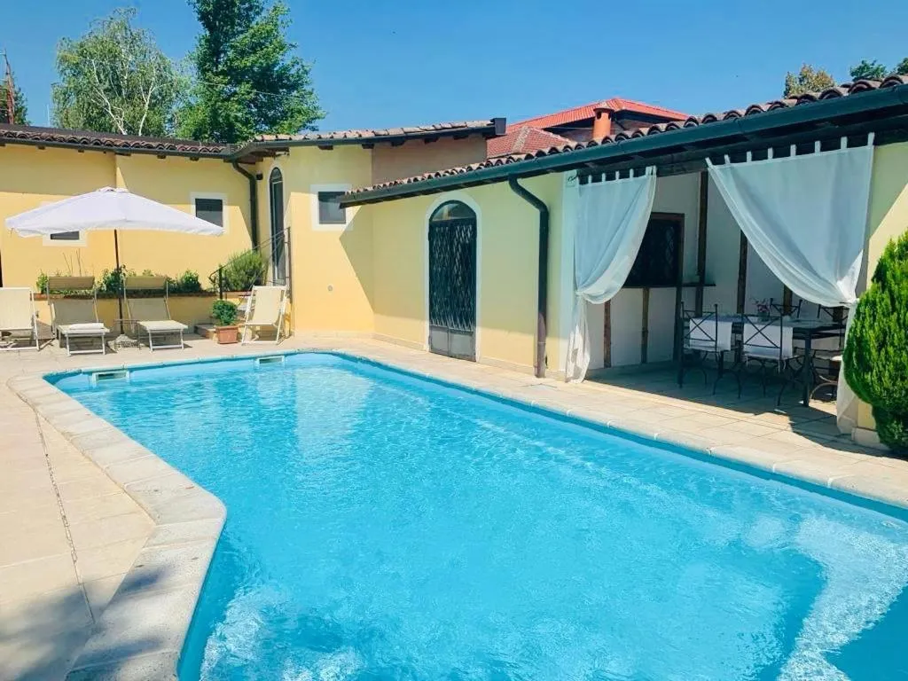 Pool view in Relais Torre Dei Torti - Luxury Bed and Breakfast